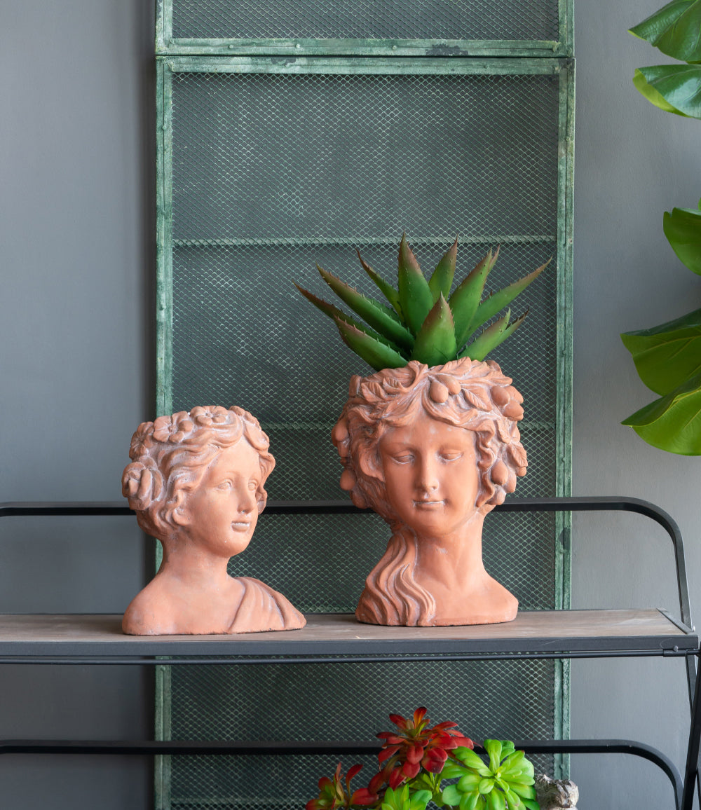 Terracotta head planter with detailed facial features and floral crown