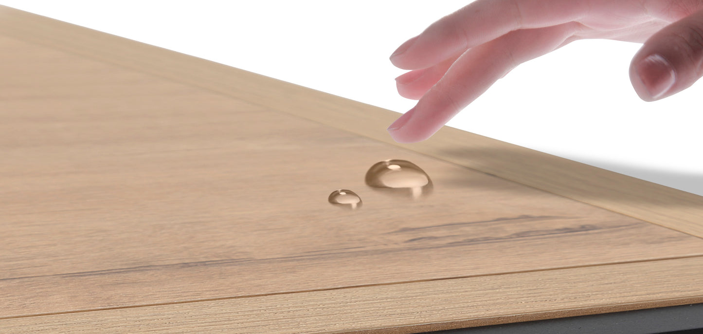 Water drops beading on a light oak laminate flooring sample showing scratchresistant surface