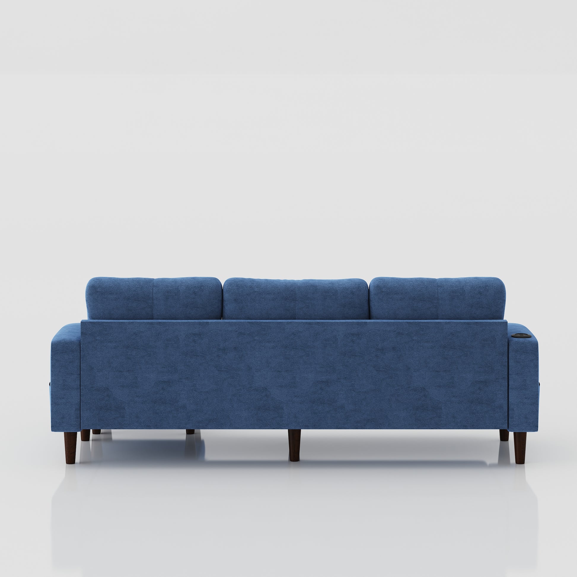 Blue velvet threeseater sofa with tufted back cushions and dark wooden legs