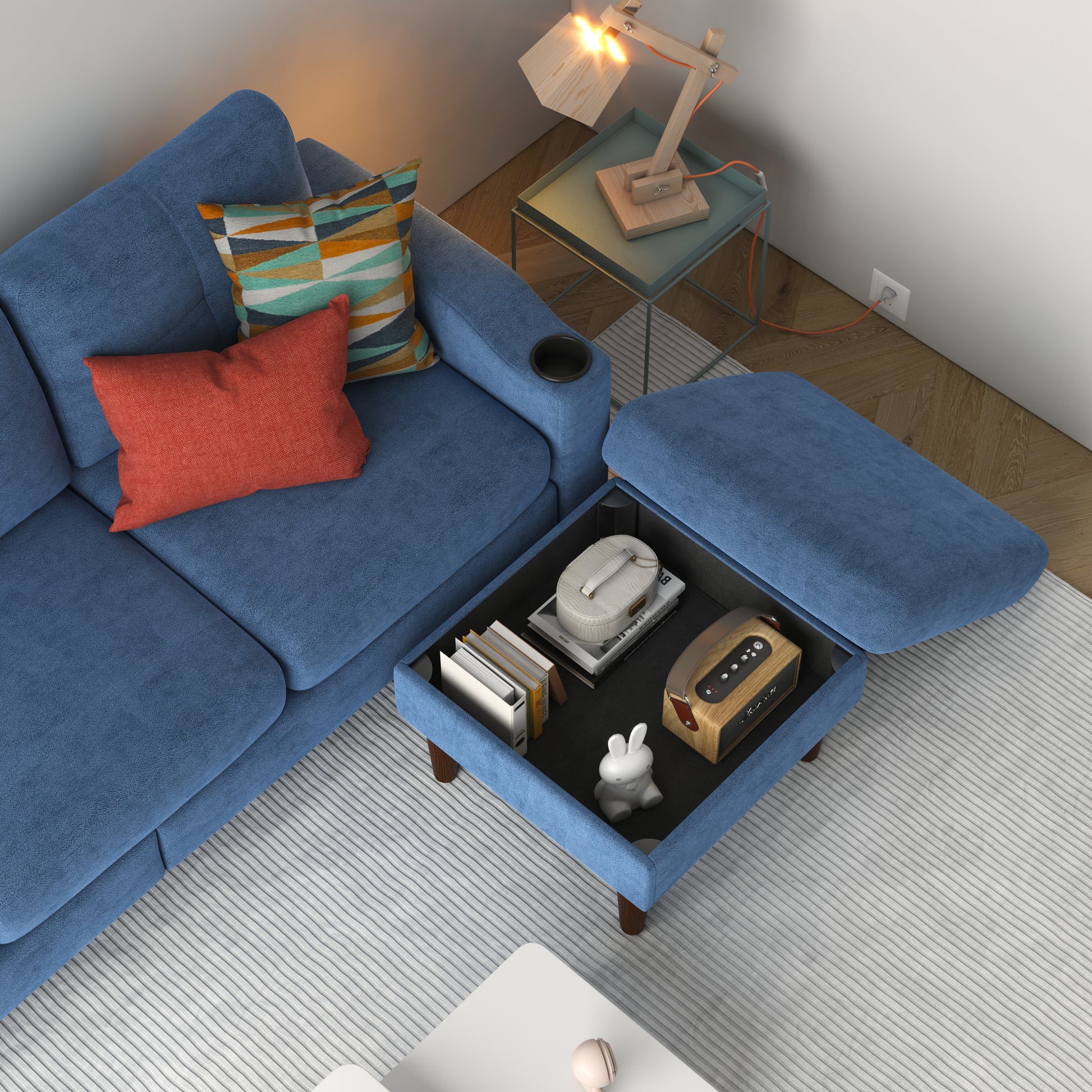 Blue sectional sofa with storage ottoman cup holder and patterned throw pillows