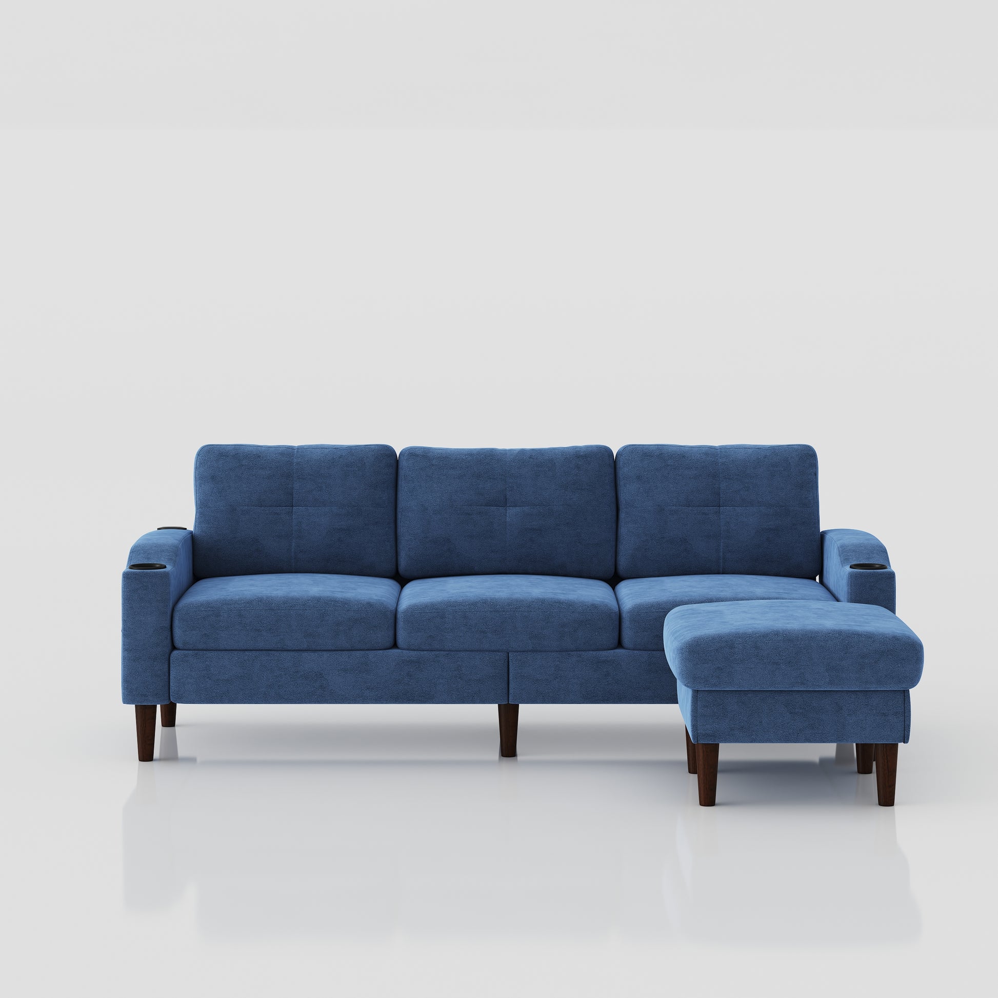 Blue upholstered sectional sofa with three cushions and a detachable chaise ottoman
