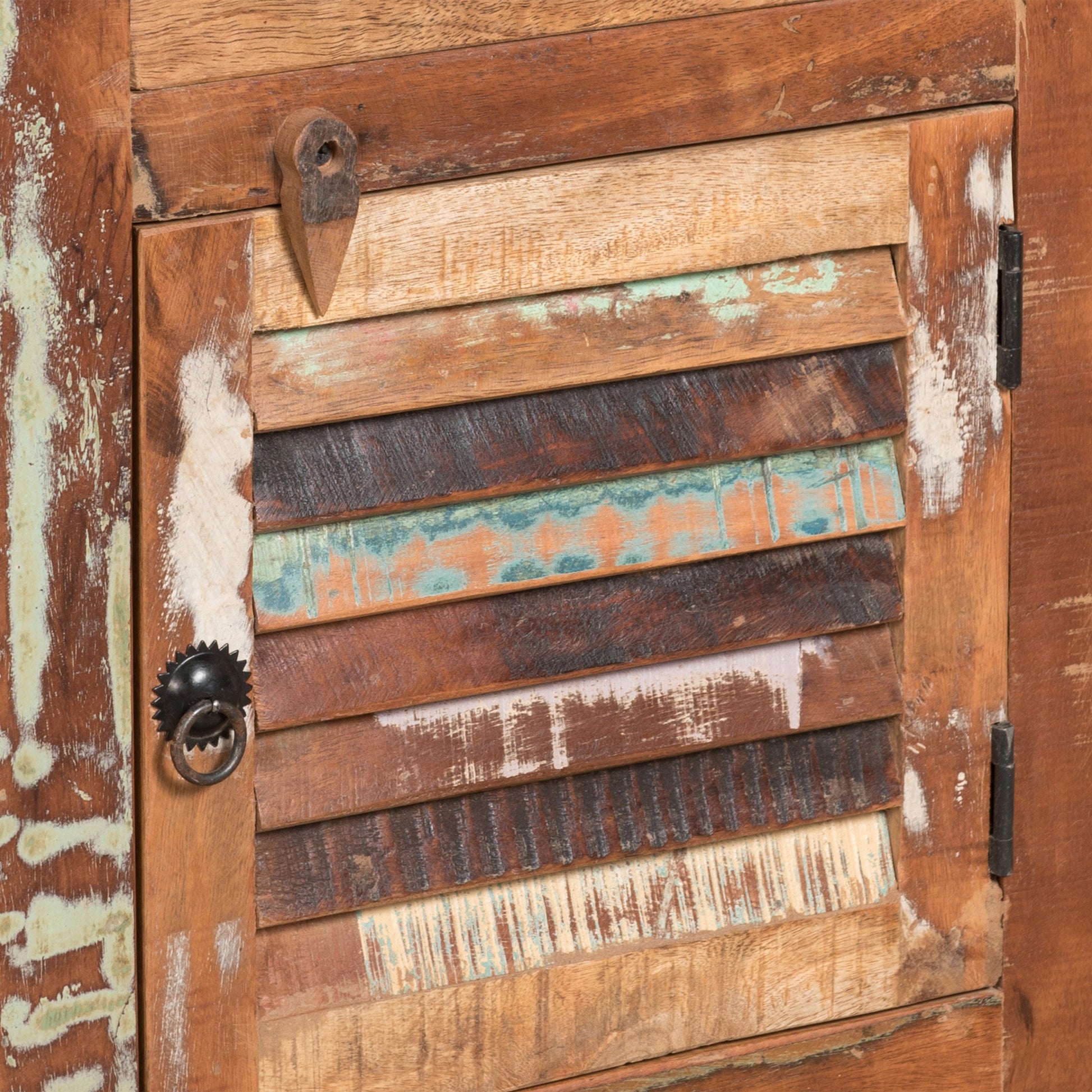 Reclaimed wood cabinet door with distressed finish and black starburst knob