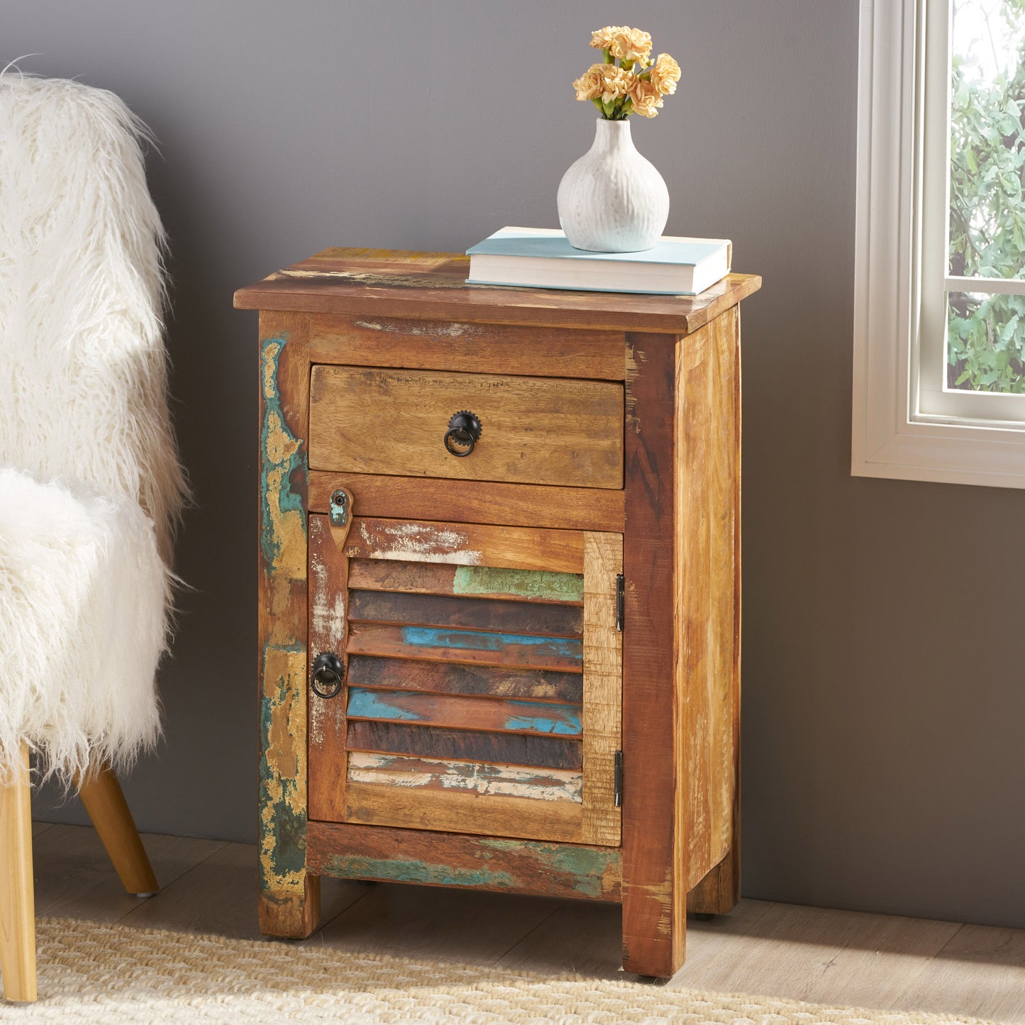 Rustic reclaimed wood nightstand with a single drawer and louvered door
