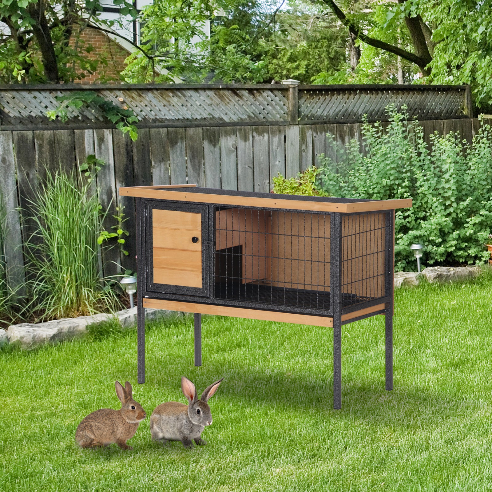 Wooden and wire rabbit hutch with two compartments elevated for outdoor pets