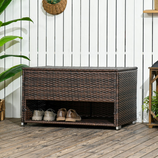 Brown rattan shoe bench with two shelves holding mens dress shoes for entryway organization