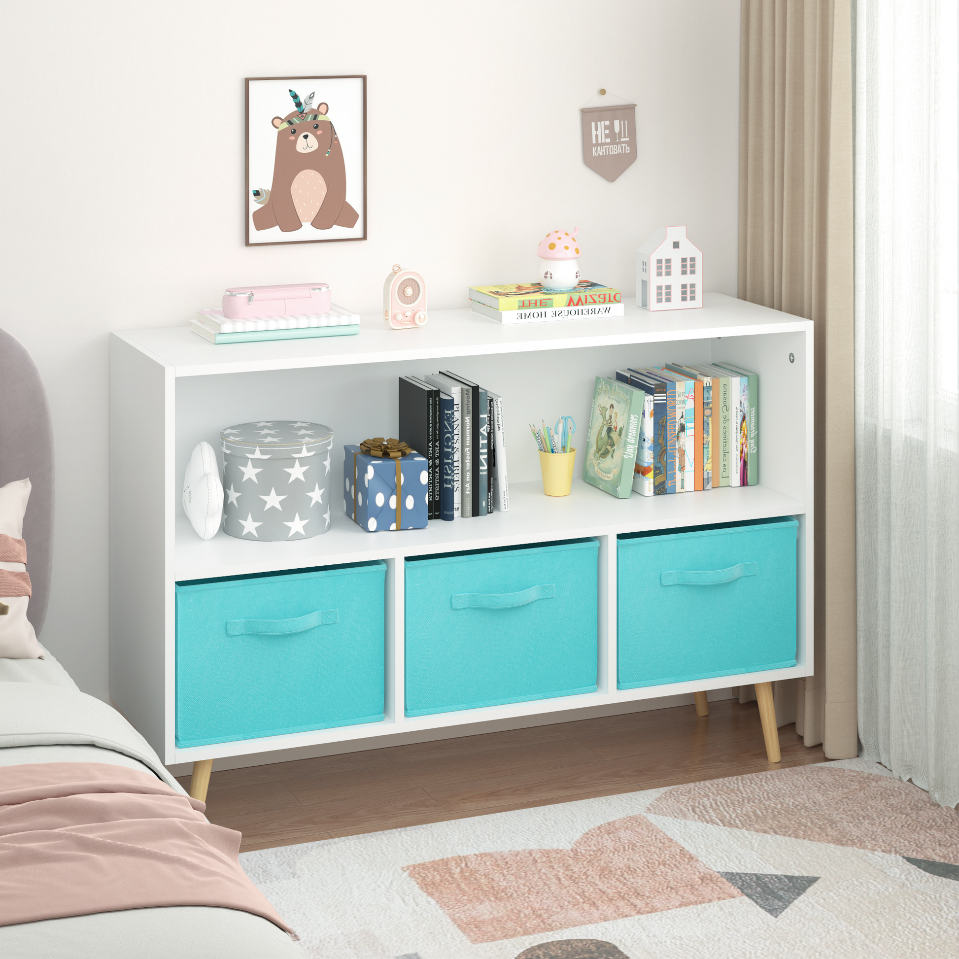 White modular storage unit with three turquoise fabric bins below and books on top