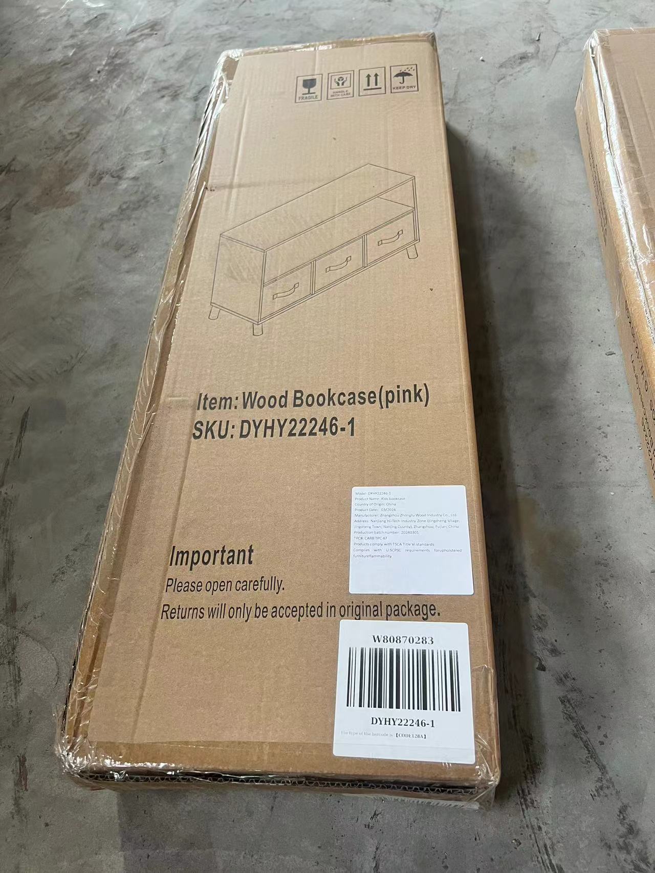 Cardboard box packaging for a pink wood bookcase with two drawers