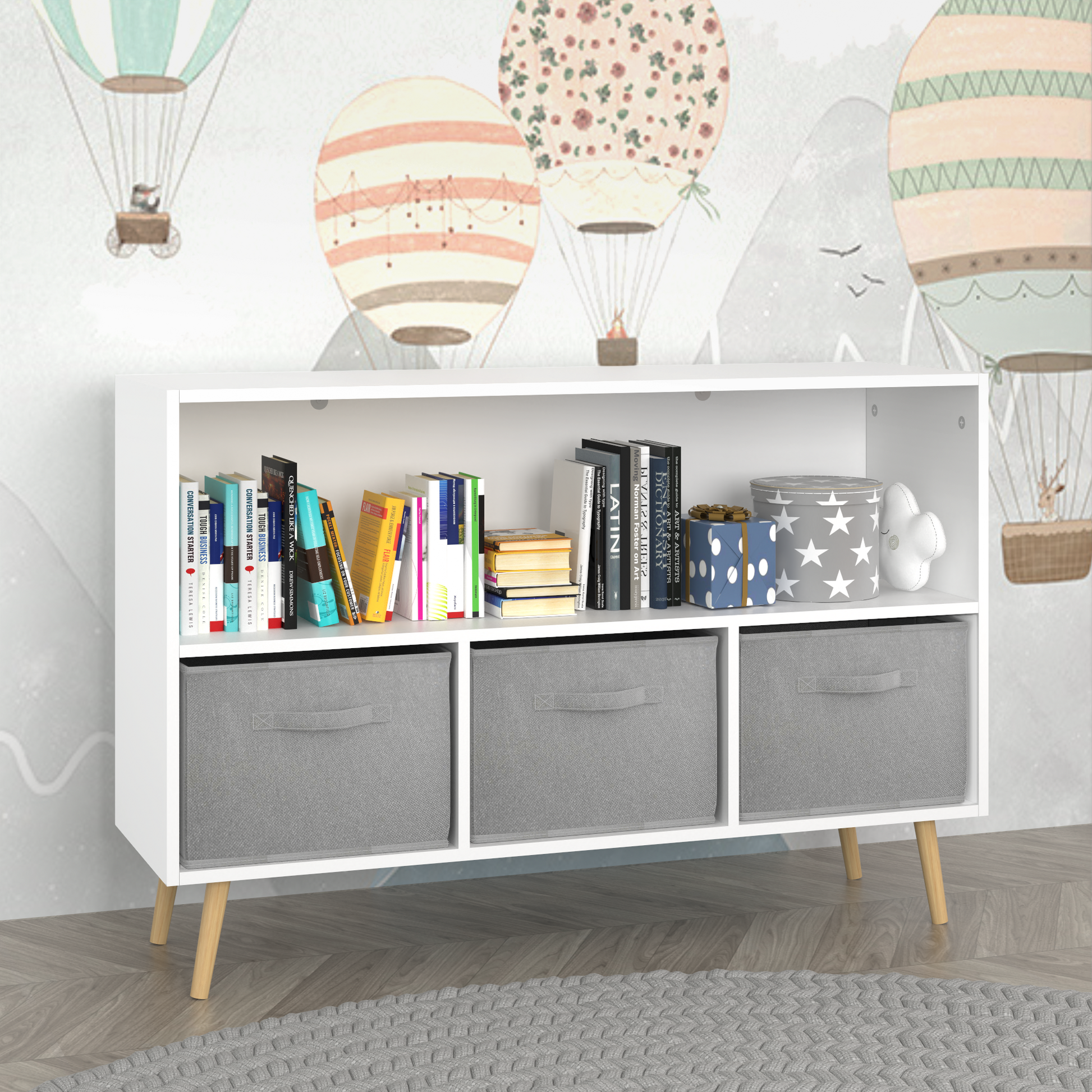 White bookshelf with three grey fabric storage cubes and wooden legs