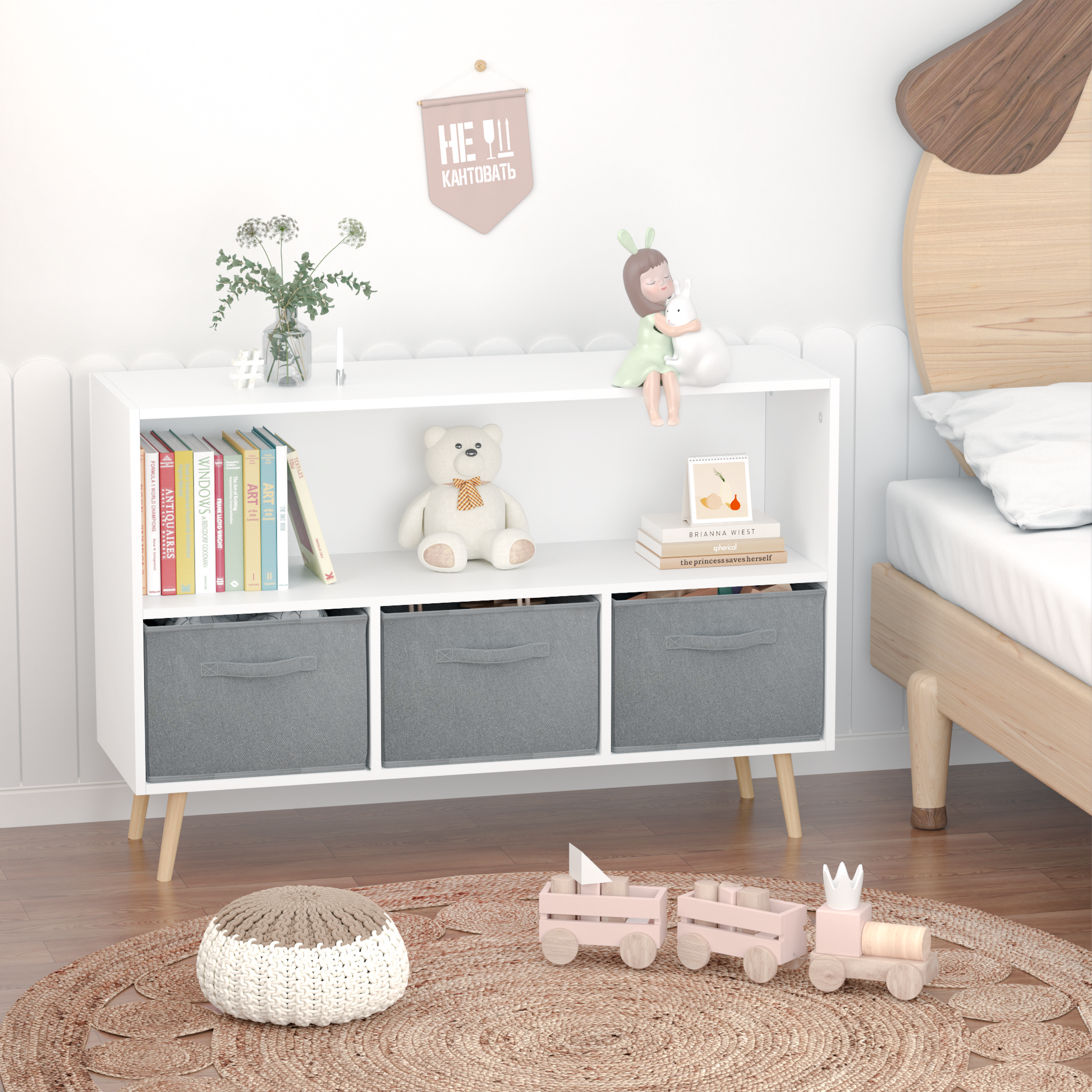 White bookshelf with a teddy bear books and gray storage bins for kids room