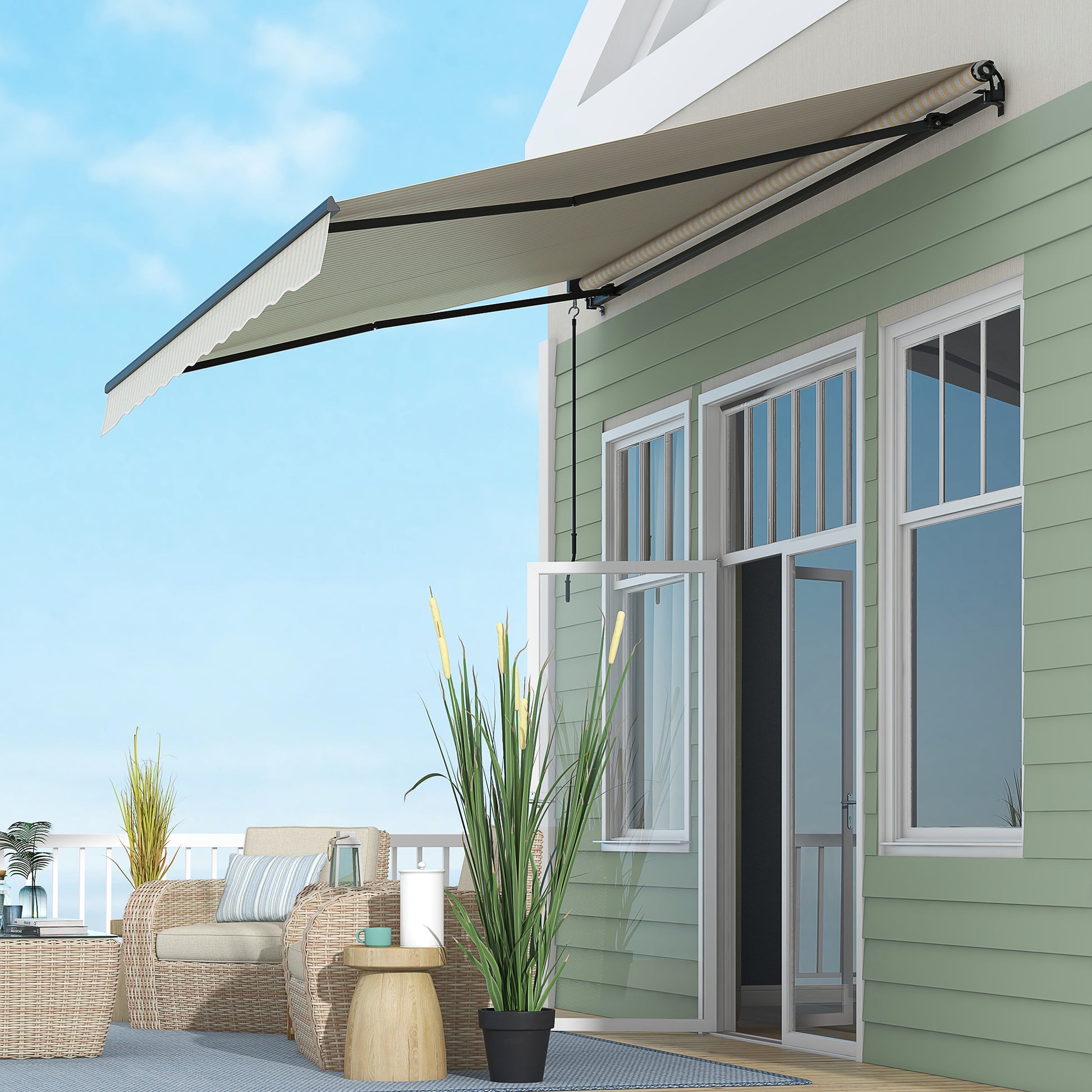 Retractable patio awning in beige with a scalloped valance extending over a green house exterior