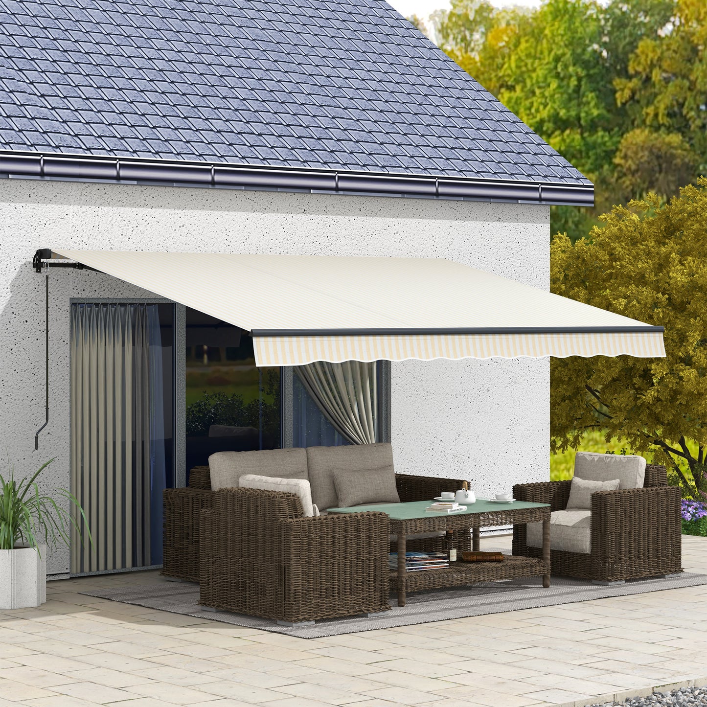 Motorized patio awning in cream with subtle yellow stripes extending over outdoor seating