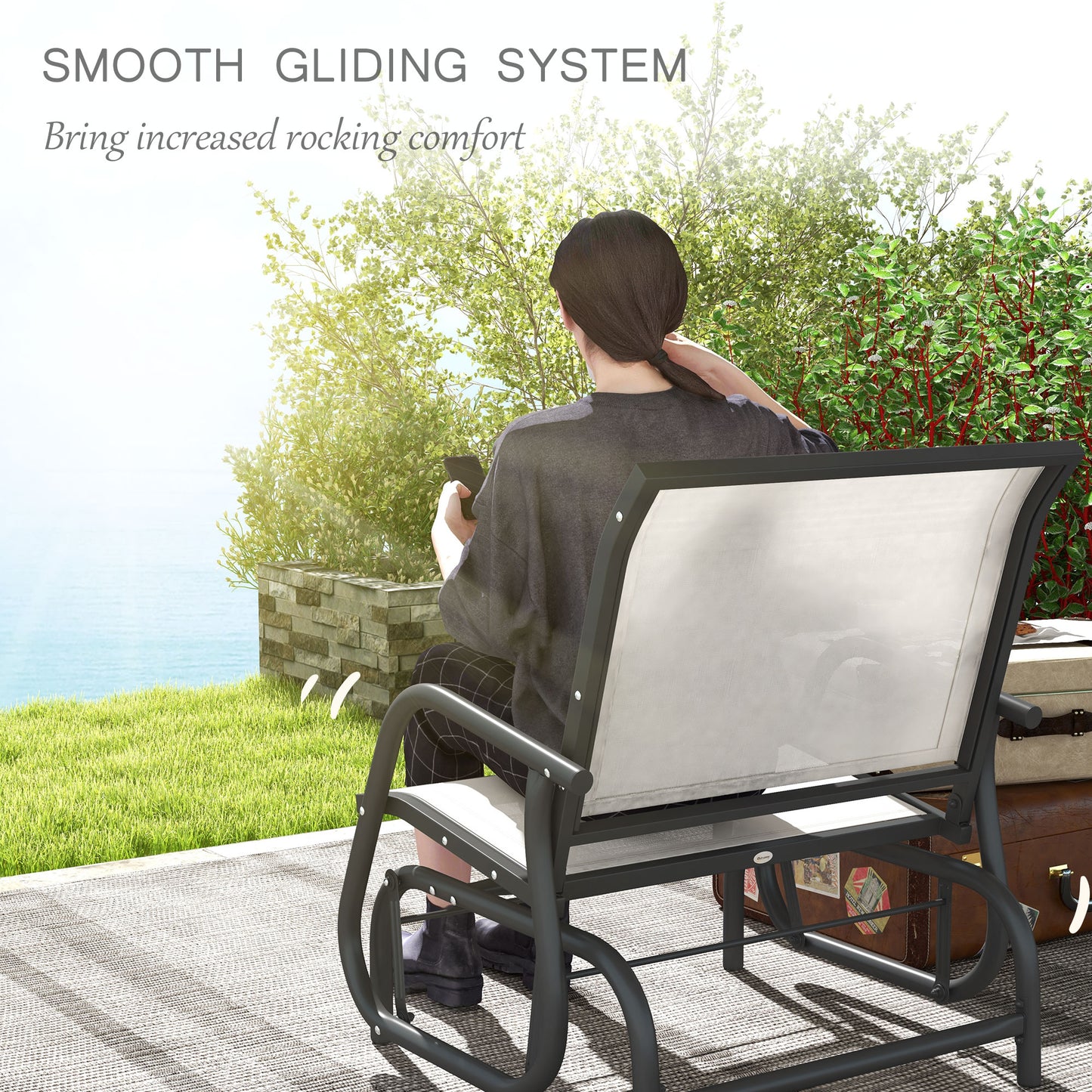 Dark grey metal patio glider with white mesh seat perfect for outdoor relaxation
