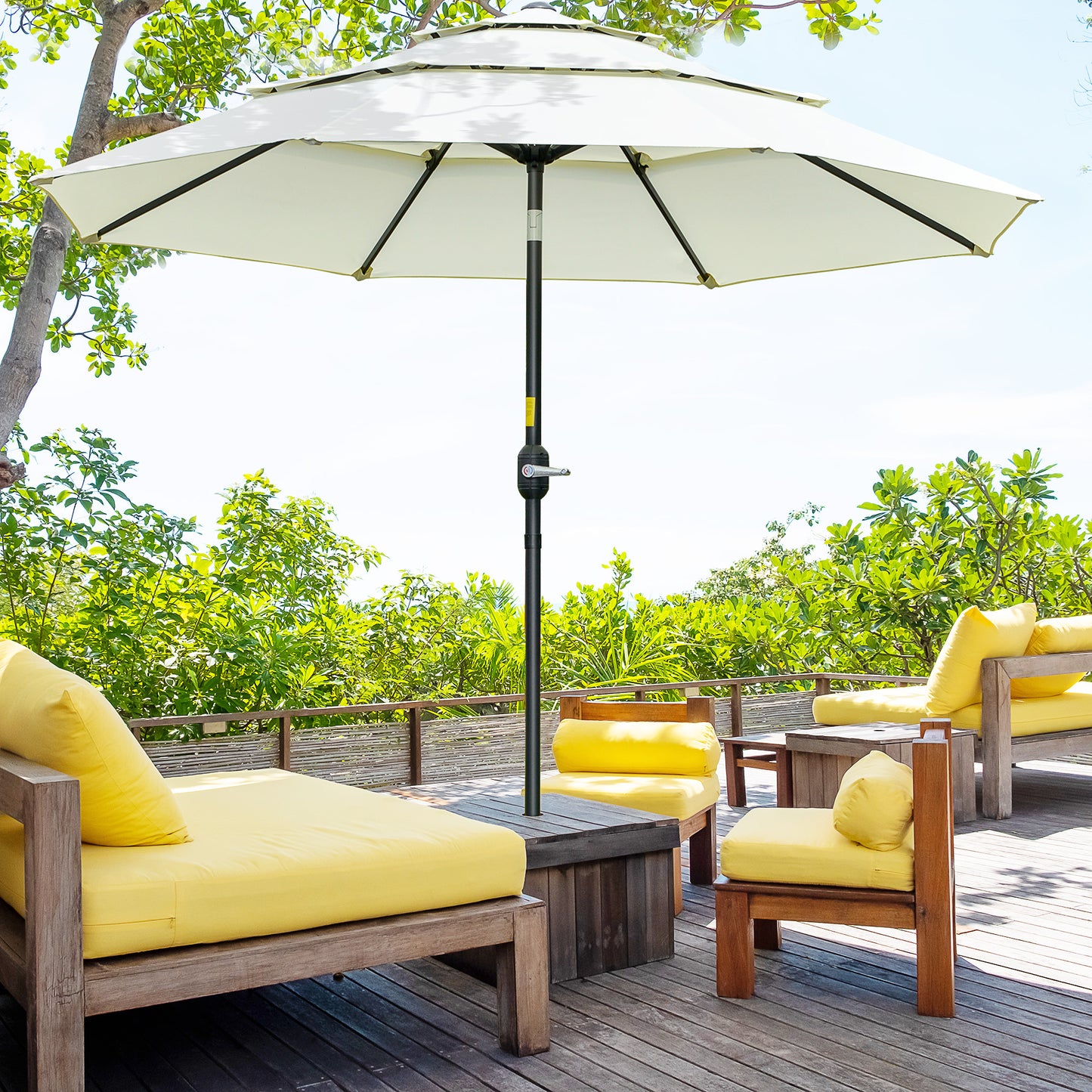 Cream patio umbrella with crank lift providing shade for outdoor seating