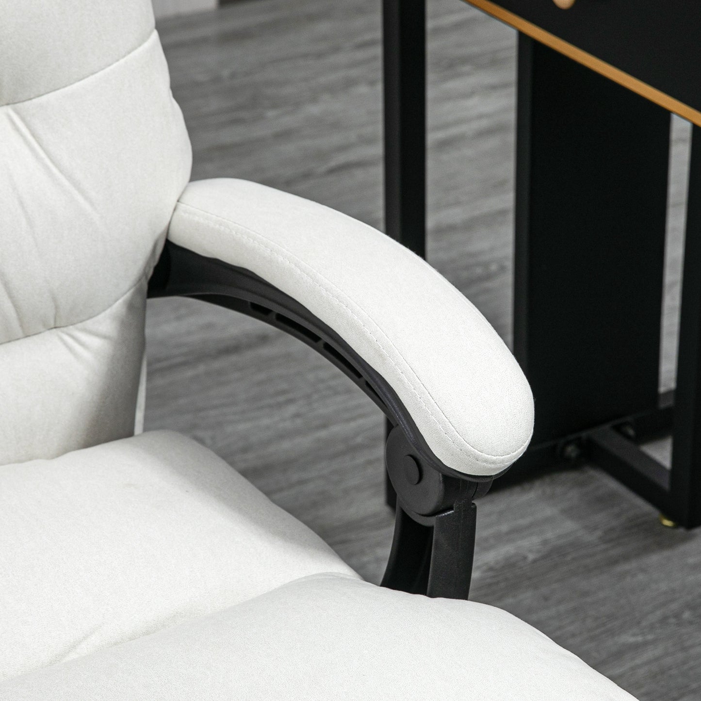 Closeup of a padded white fabric office chair armrest with adjustable black support
