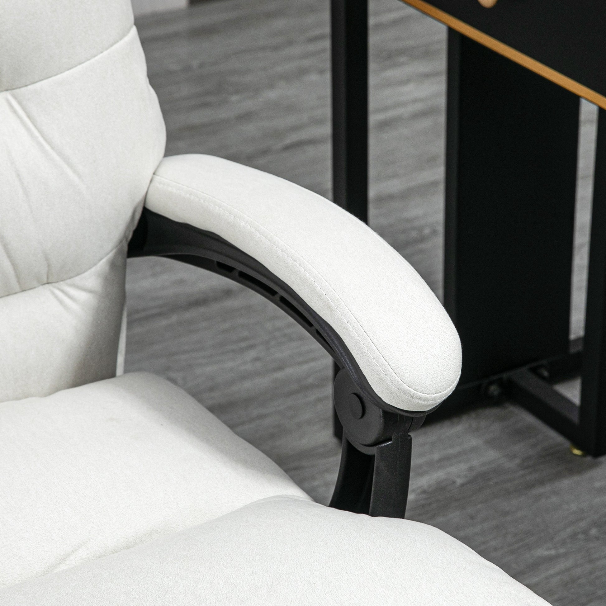 Closeup of a padded white fabric office chair armrest with adjustable black support