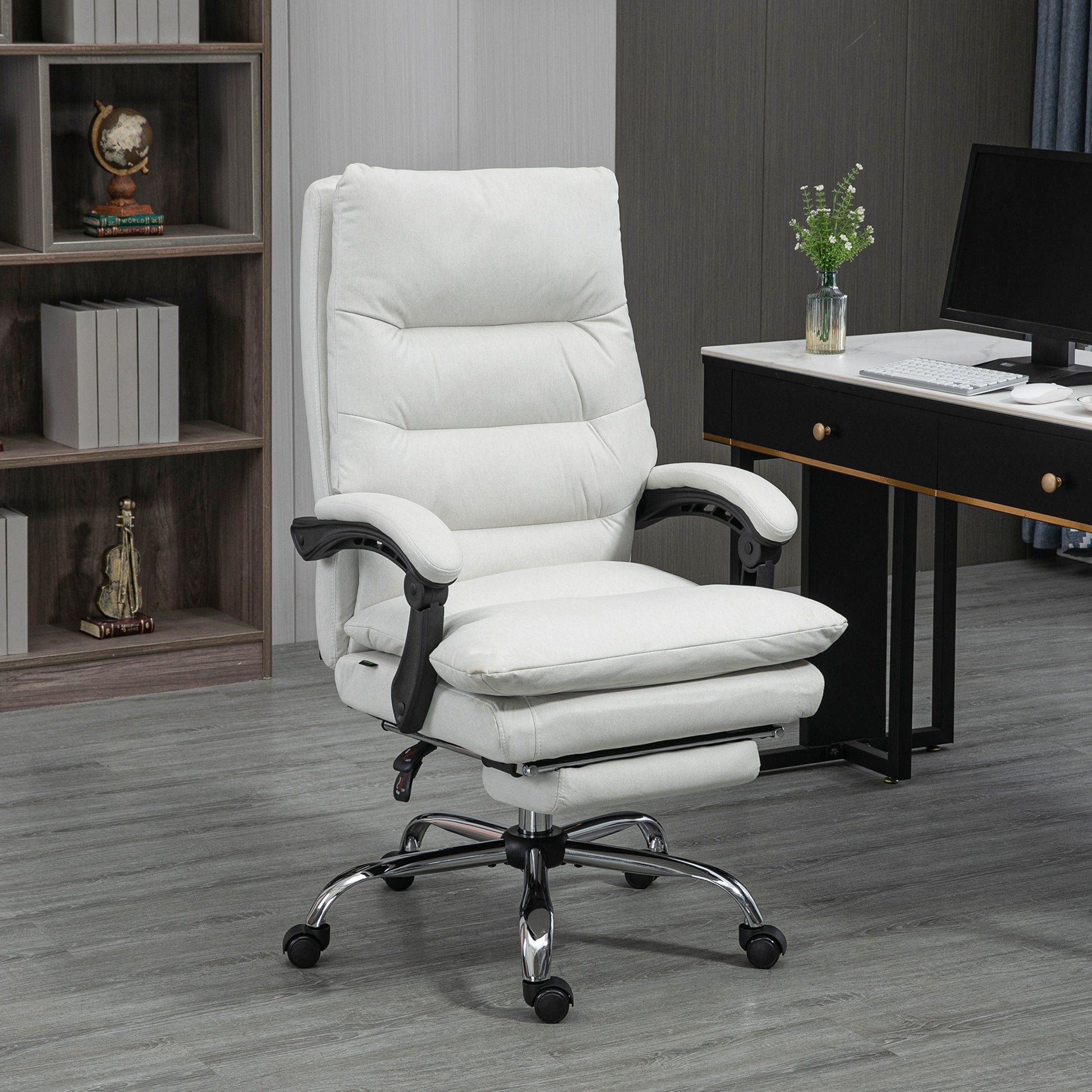 Ergonomic white office chair with adjustable footrest and padded seat for comfort