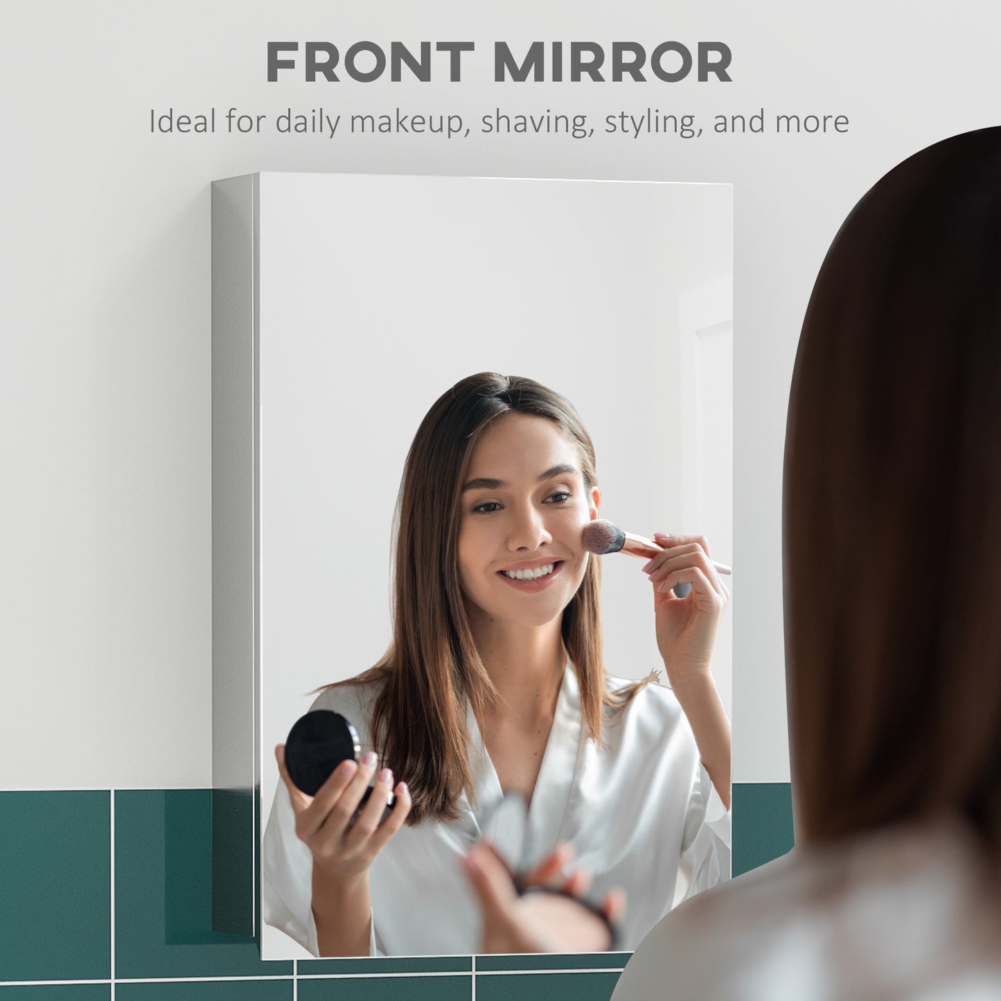Silver framed bathroom mirror reflecting a smiling woman applying makeup