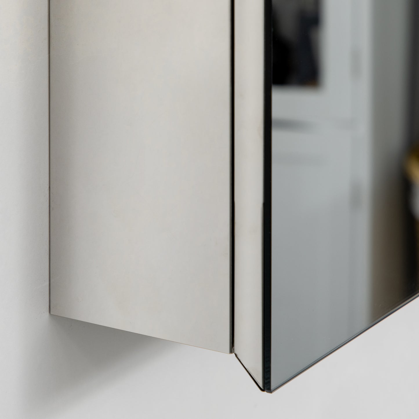 Sleek silver medicine cabinet with mirrored door and clean lines