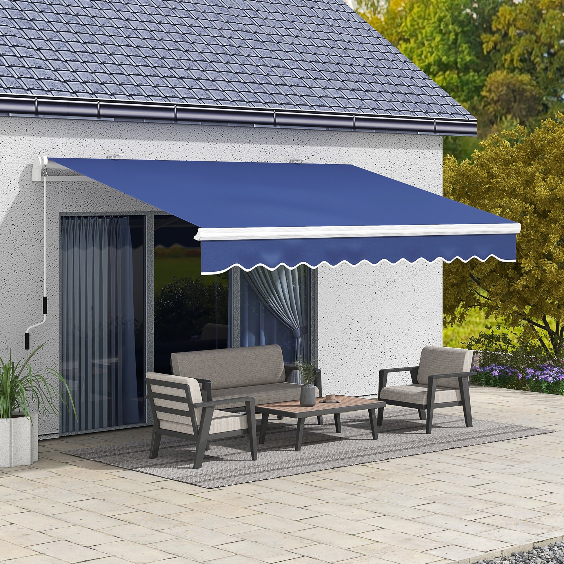 Blue retractable awning with scalloped edge providing shade for patio furniture