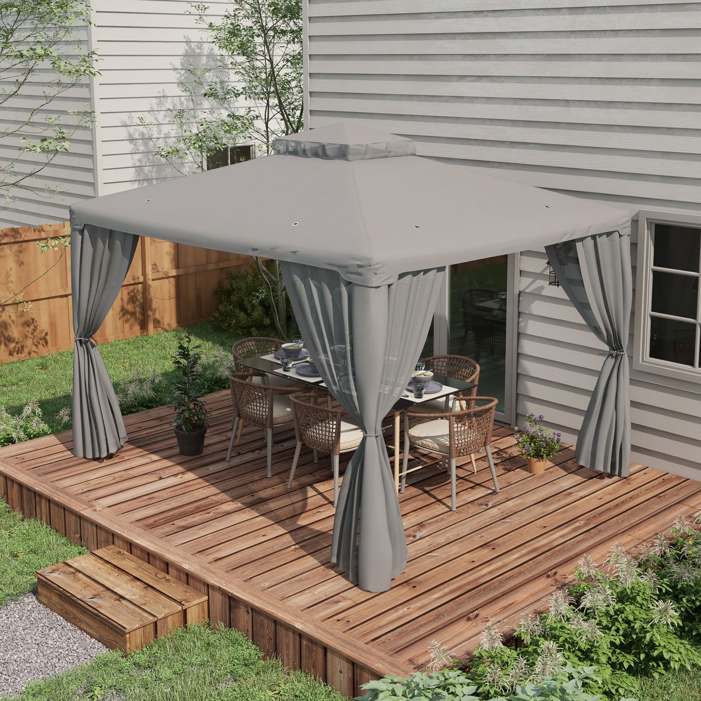 Gray outdoor canopy with curtains framing a dining set on a wooden deck