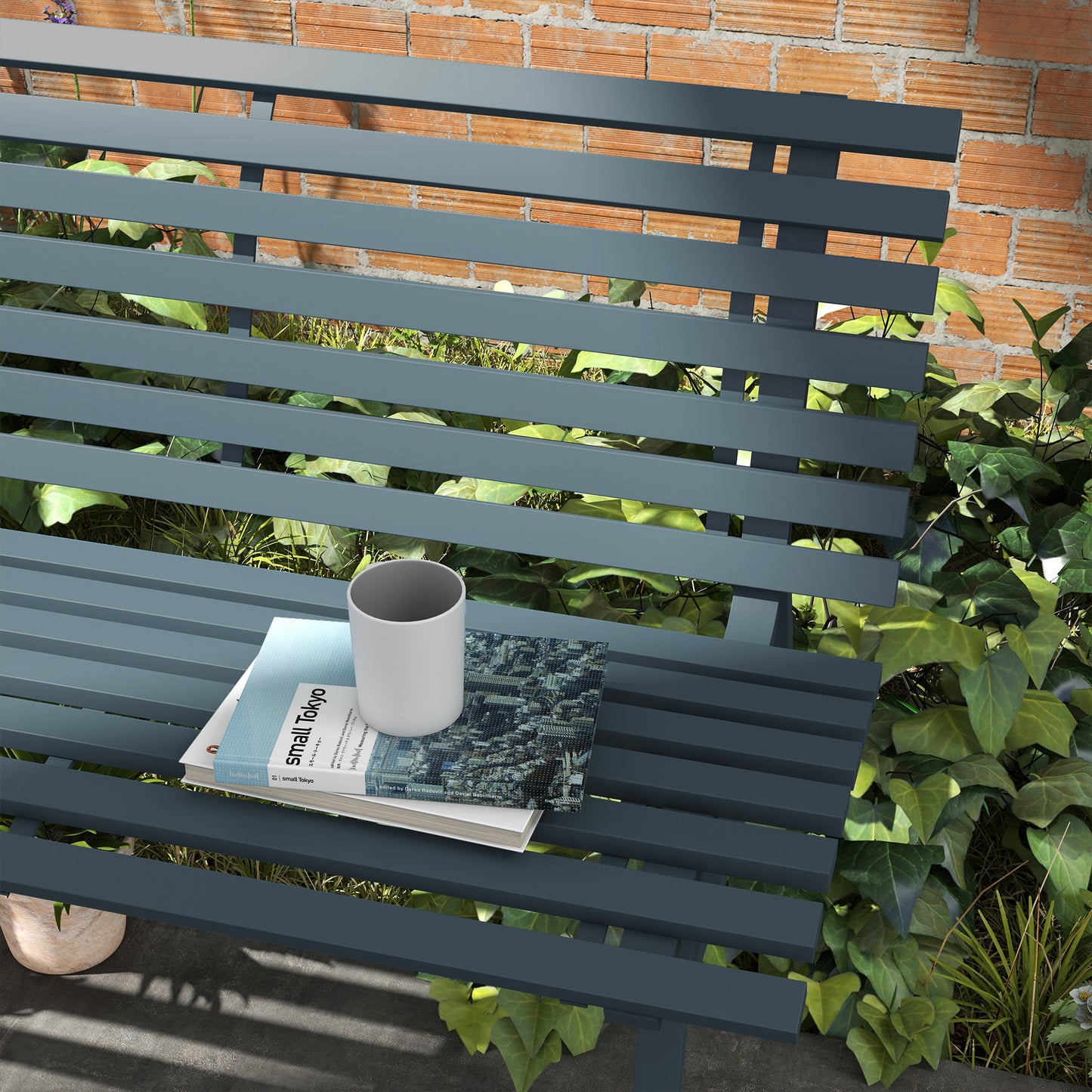 Dark grey metal garden bench with slate grey finish and slatted seating