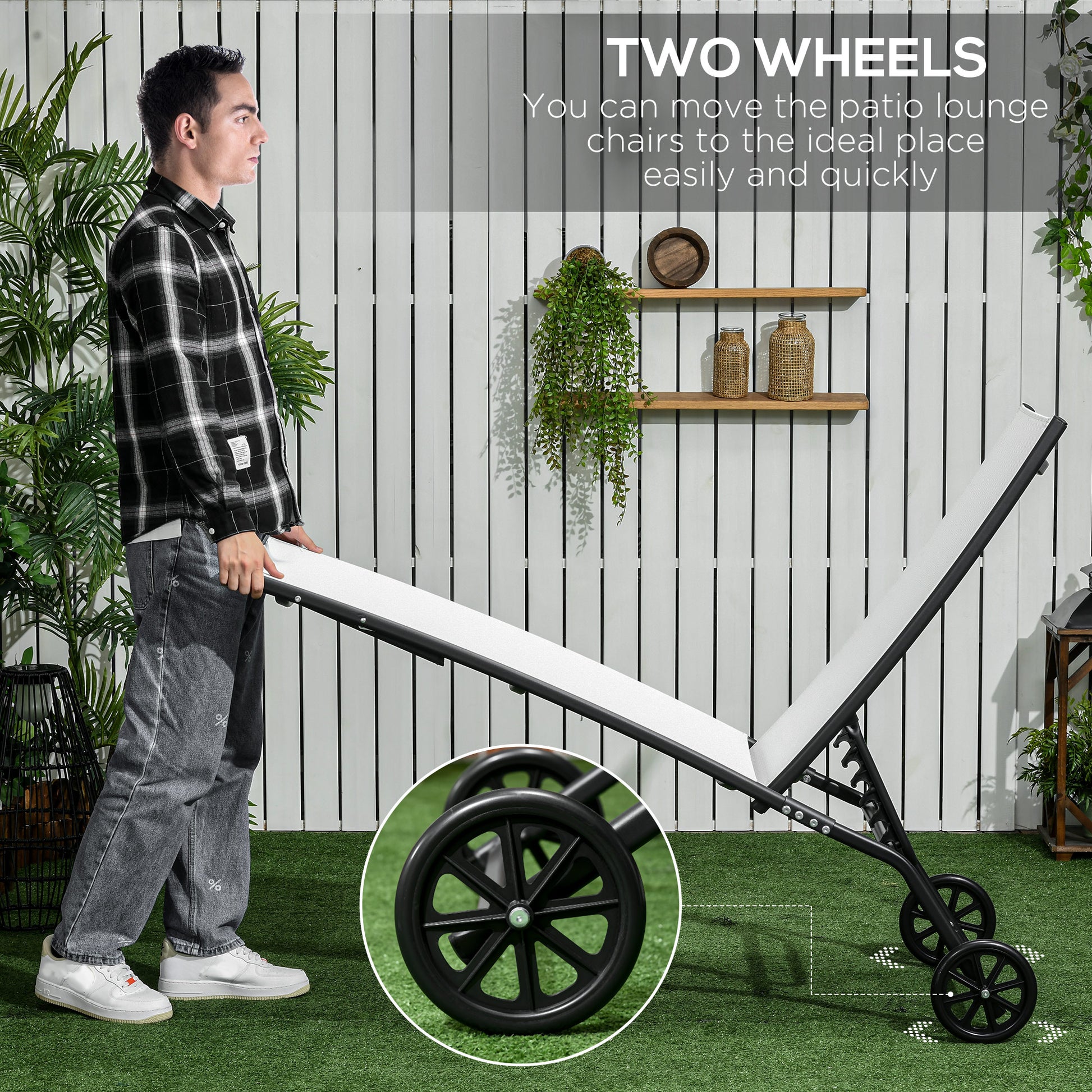 Man moving a white canvas patio lounge chair with black frame and wheels