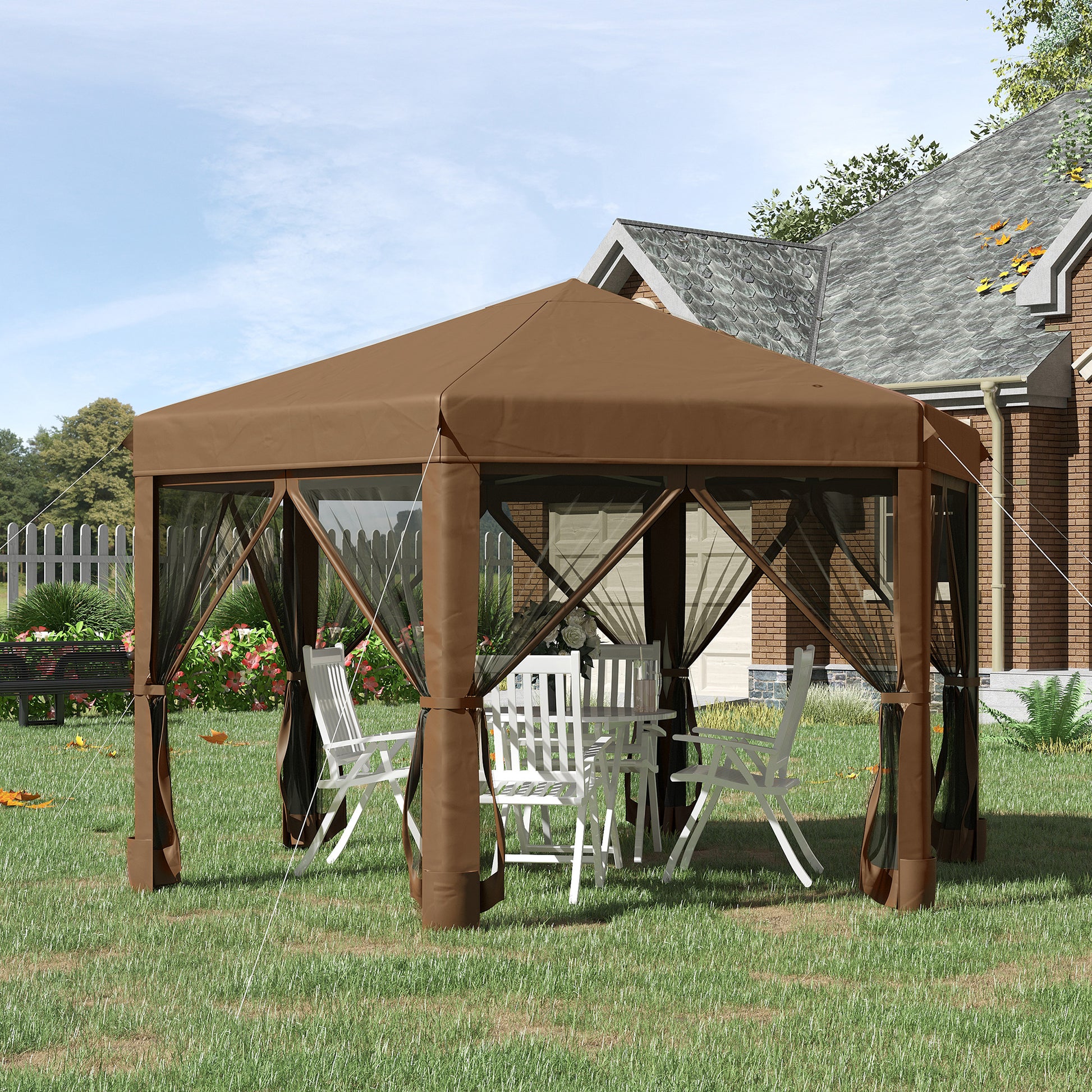 Brown patio gazebo with white chairs and table set up for outdoor dining