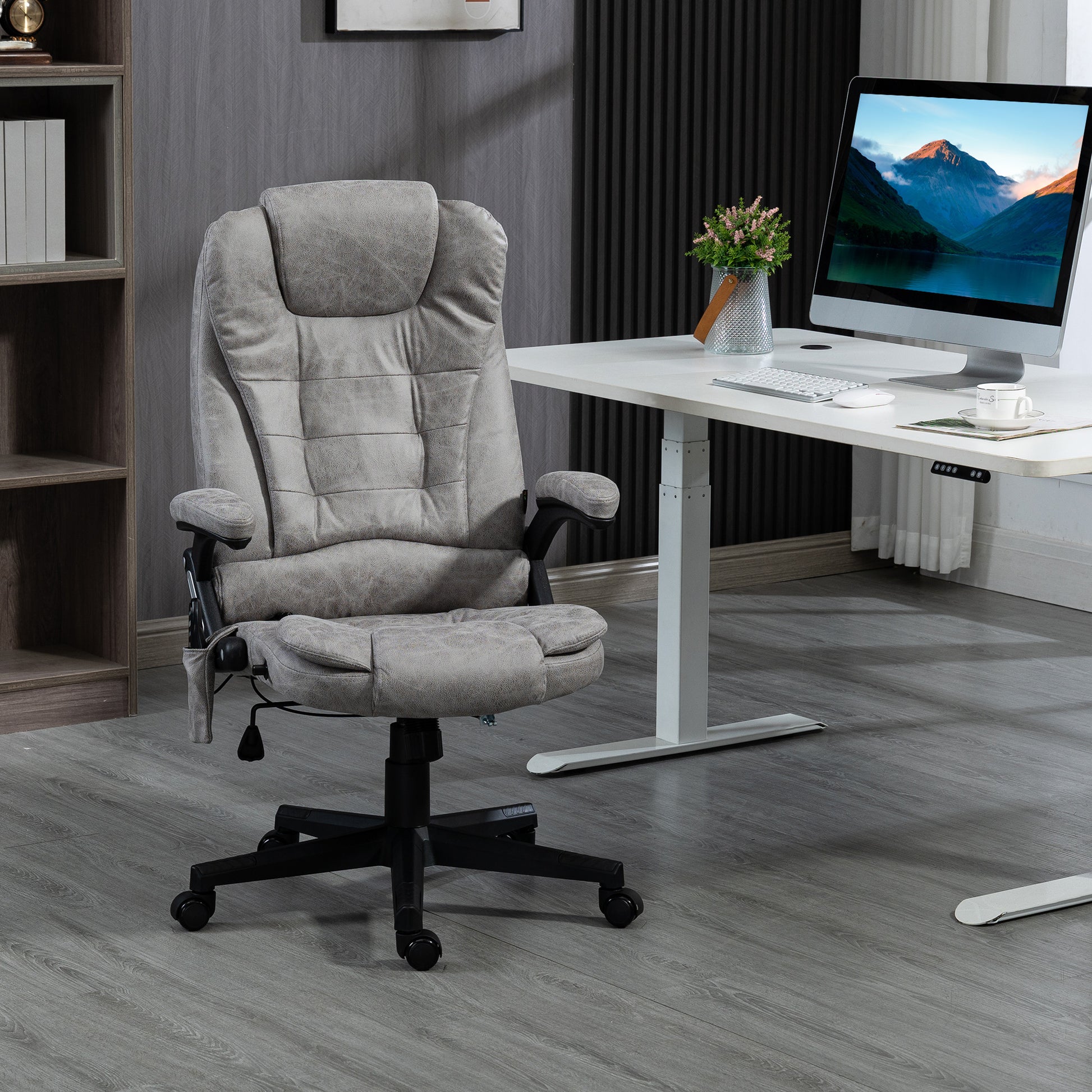Plush grey ergonomic office chair with headrest and padded armrests
