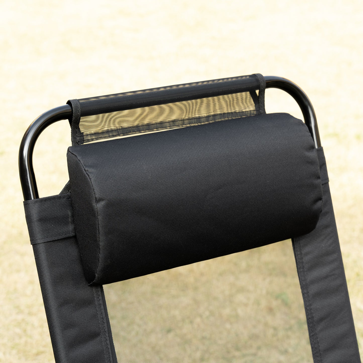 Black mesh lounger with adjustable pillow and metal frame