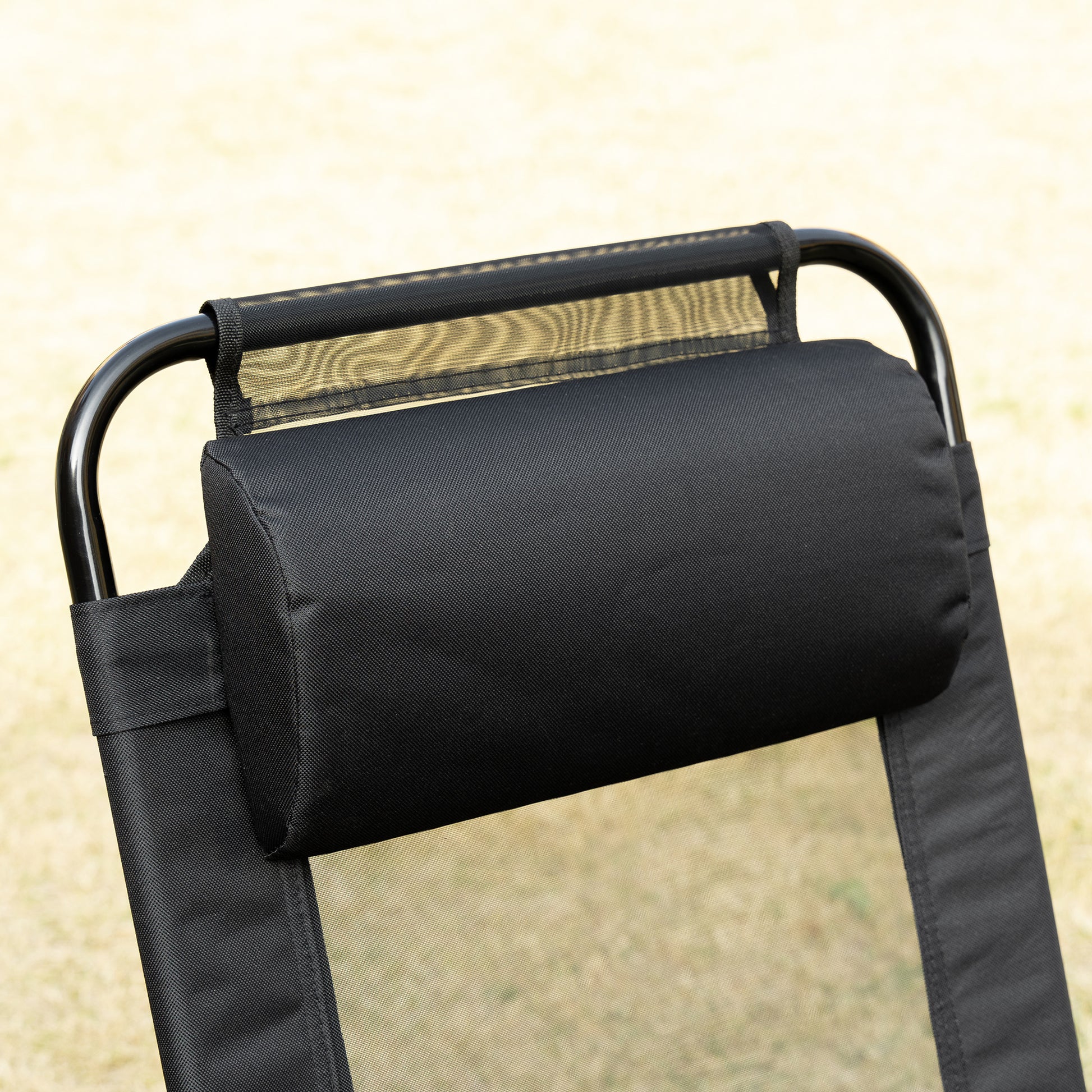 Black mesh lounger with adjustable pillow and metal frame