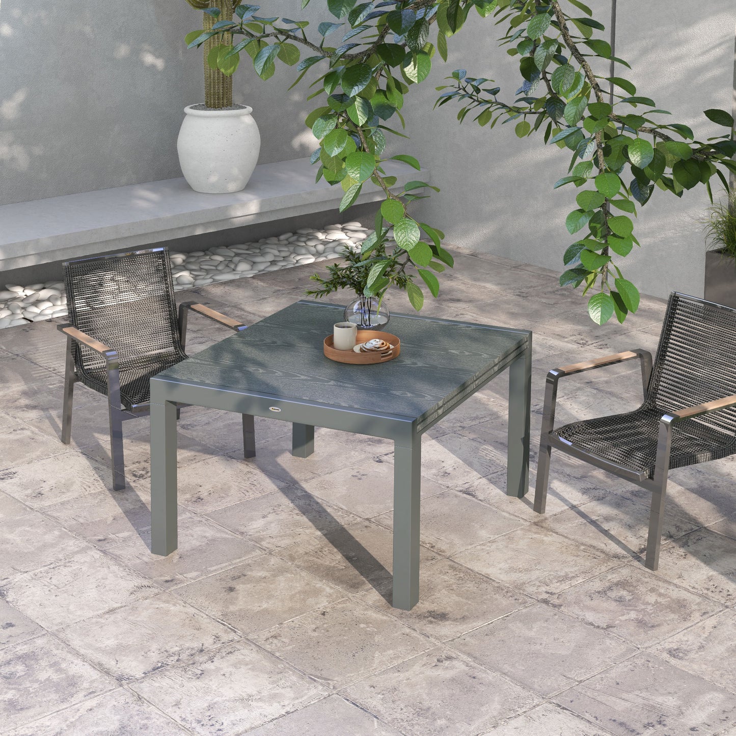 Grey metal outdoor dining table with a faux wood textured top perfect for patio use