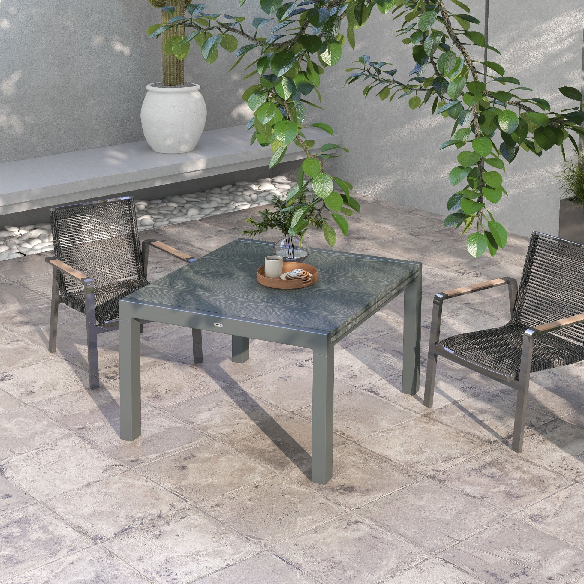 Grey metal outdoor dining table with a faux wood textured top perfect for patio use