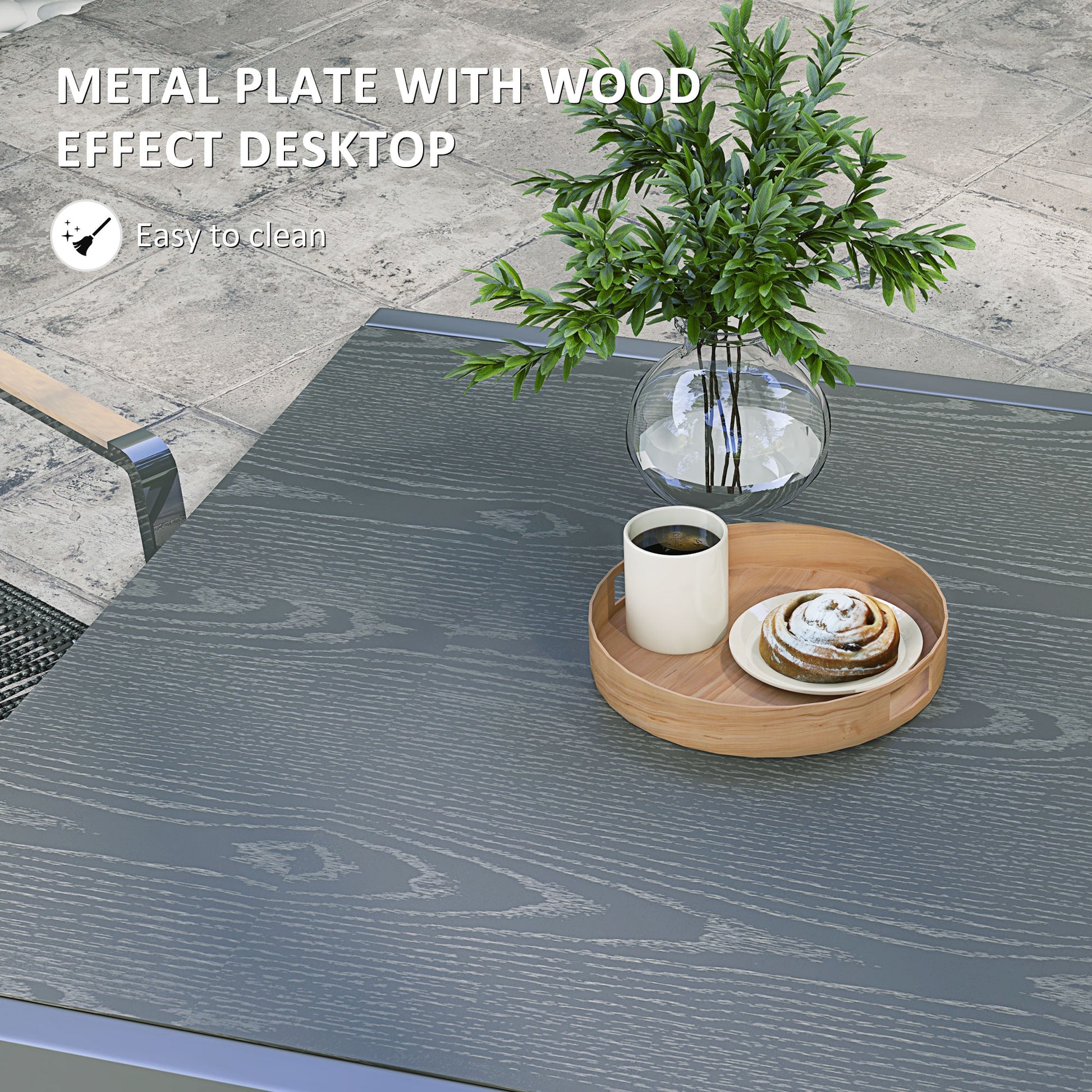 Grey wood effect desktop with a white coffee cup and pastry on a wooden tray