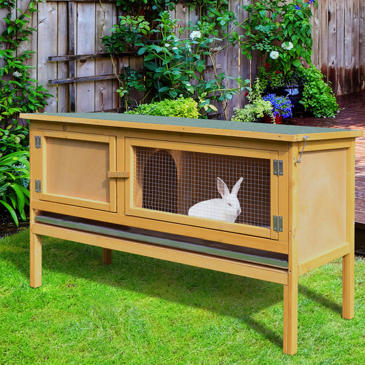 Wooden outdoor rabbit hutch with a single white rabbit visible through the wire mesh
