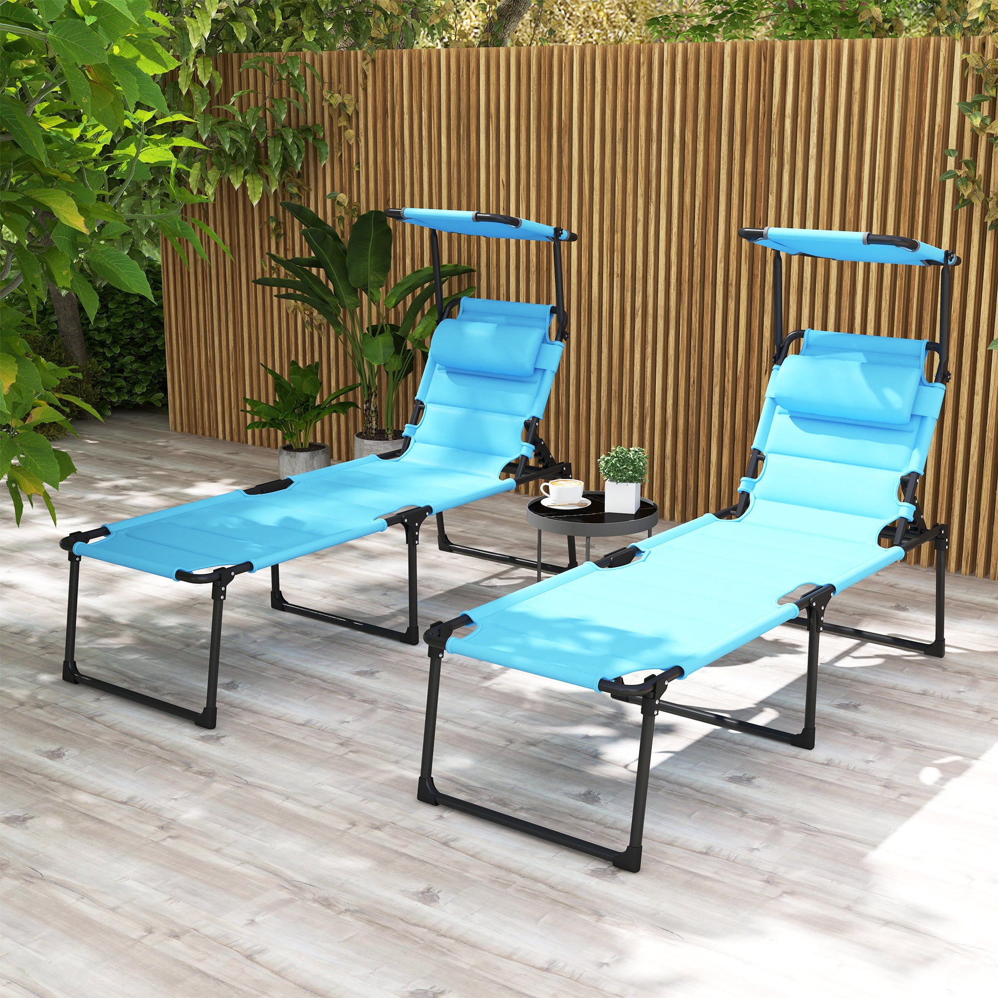 Two blue adjustable lounge chairs with canopy for outdoor relaxation