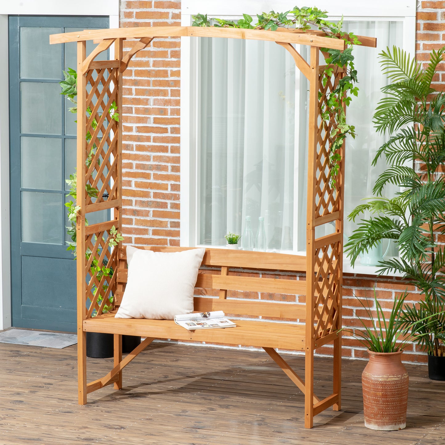 Wooden garden arch with builtin bench white pillow and vines for outdoor seating