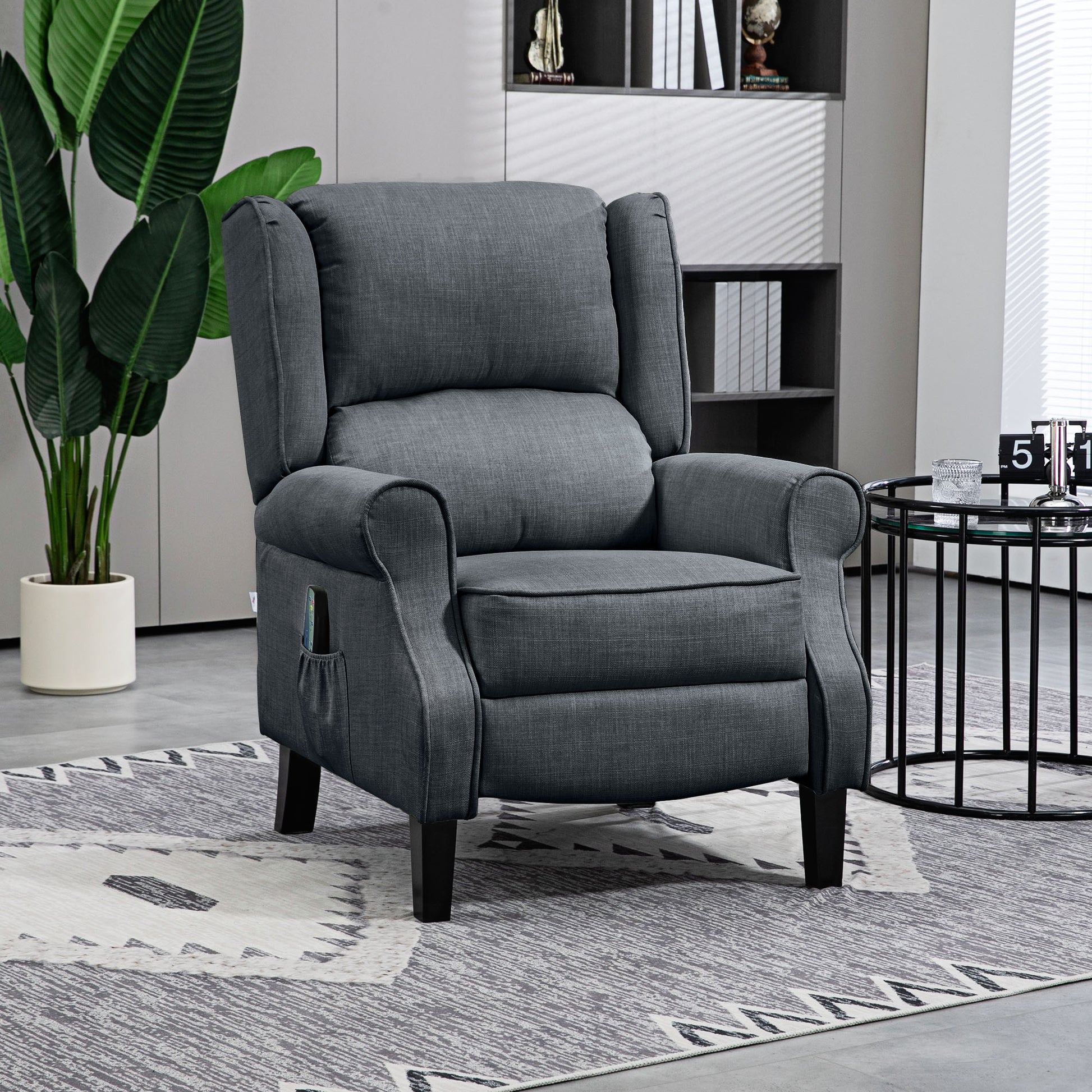 Comfortable charcoal grey fabric recliner chair with wingback and side pocket for remote