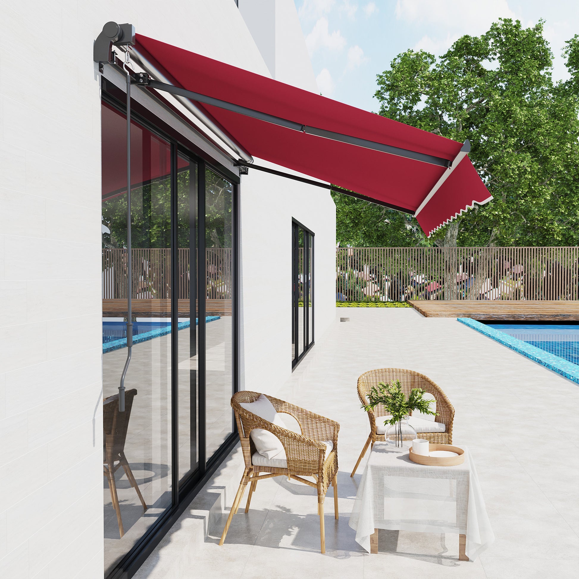 Retractable awning in deep red with scalloped valance providing shade for a modern patio