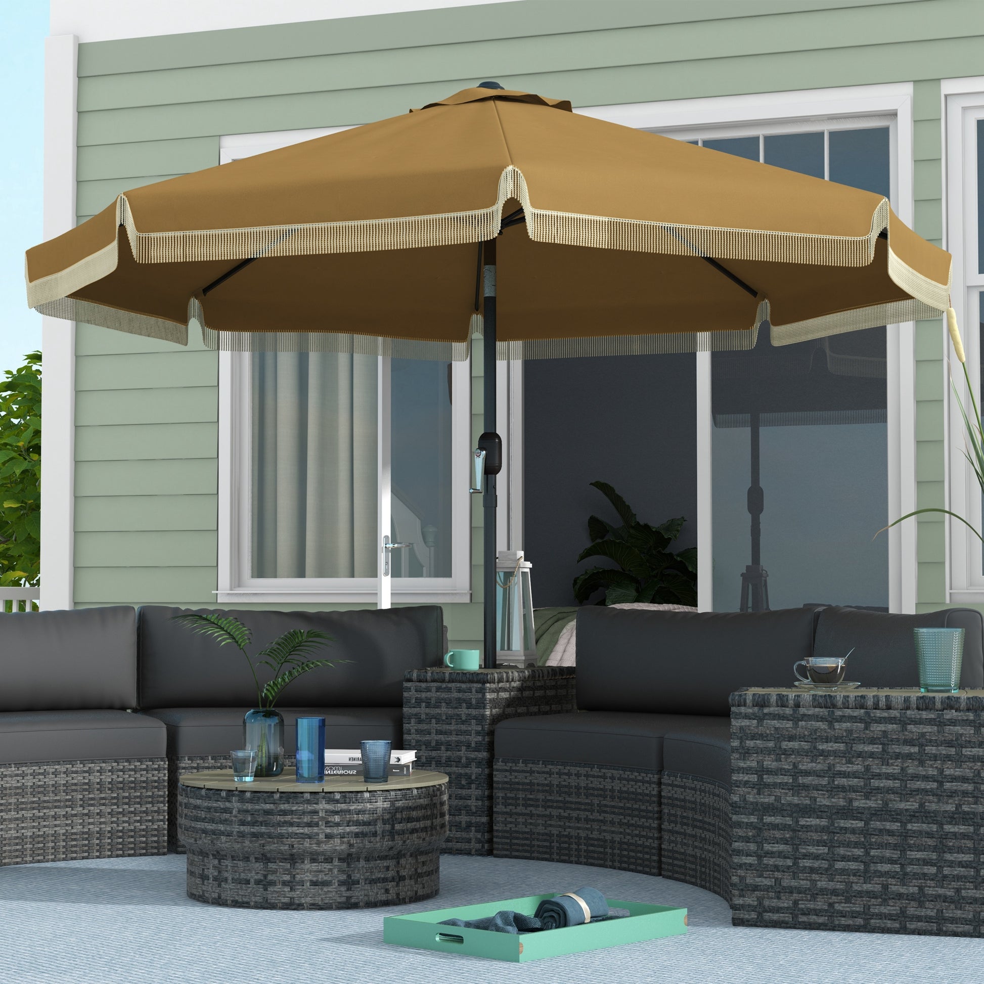 Bronze patio umbrella with decorative fringe providing shade over sectional furniture
