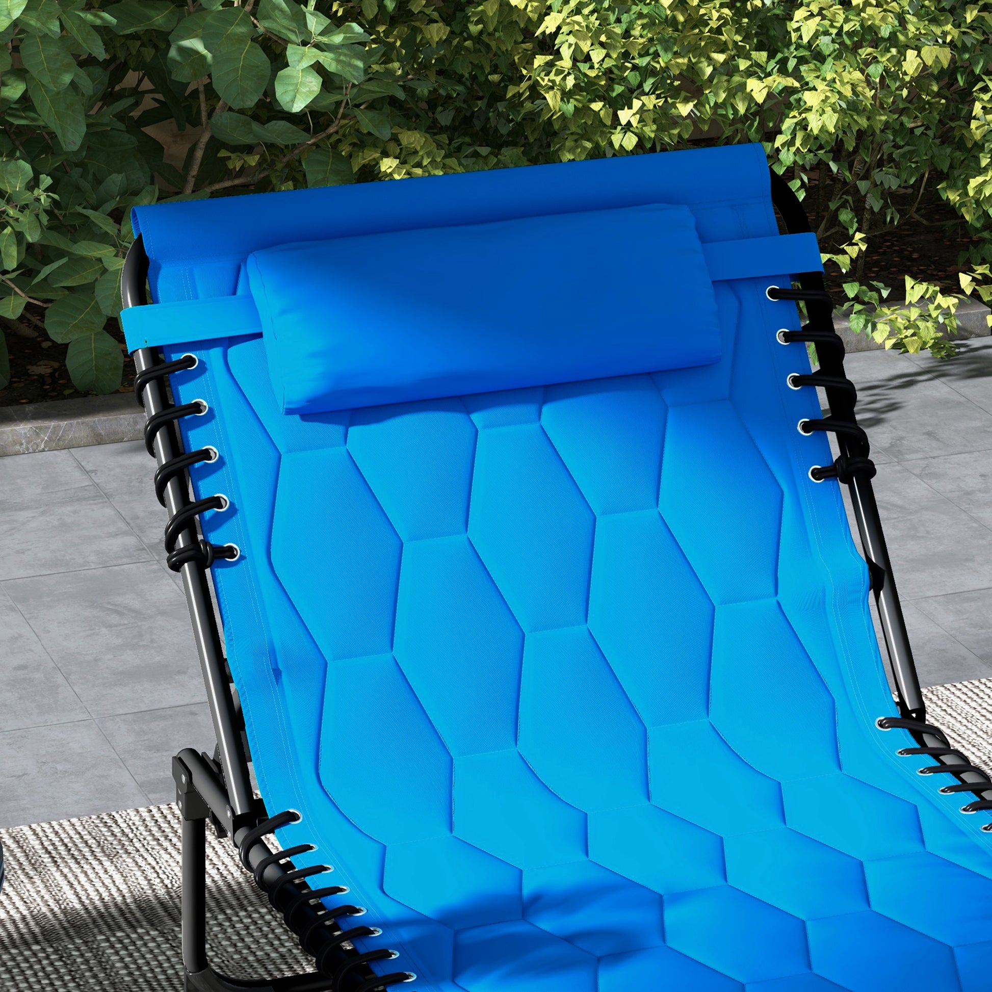 Blue zero gravity chair with padded headrest hexagonal stitching and black bungee cords