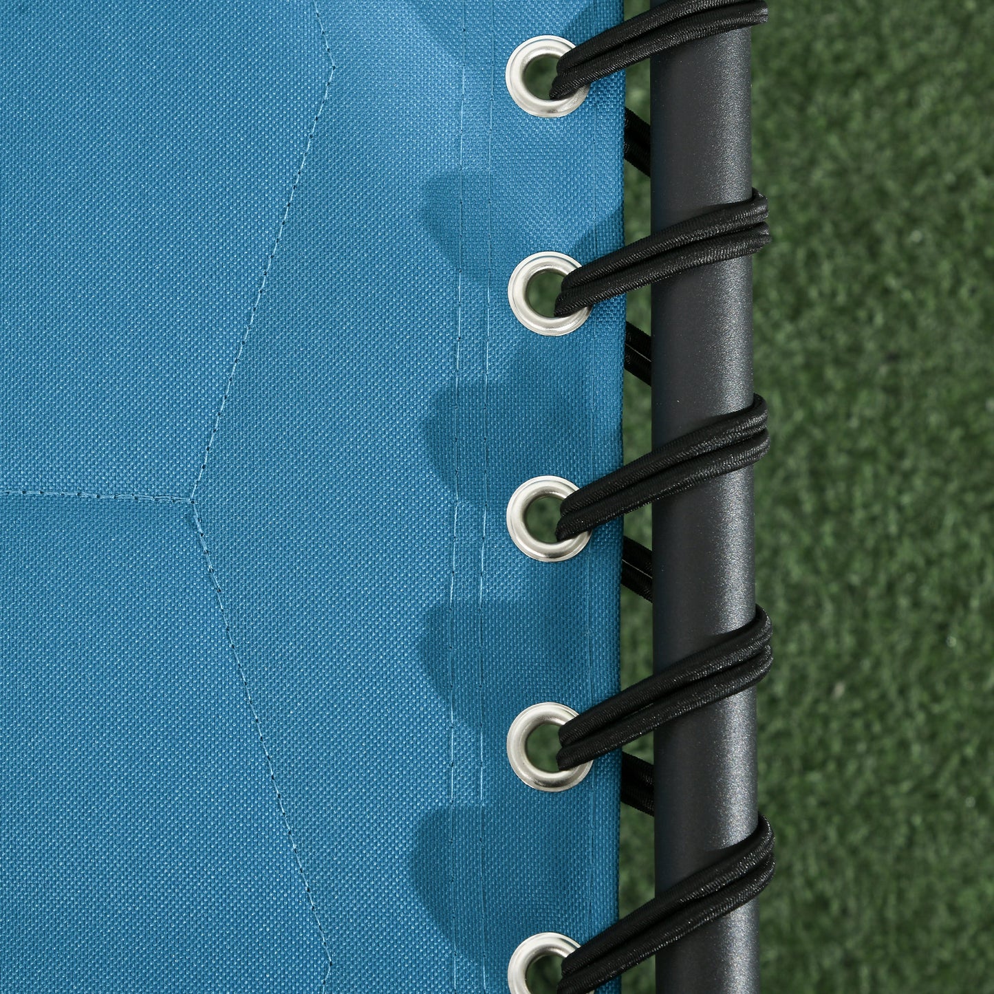 Blue canvas lounge chair fabric with reinforced grommets and black bungee cords