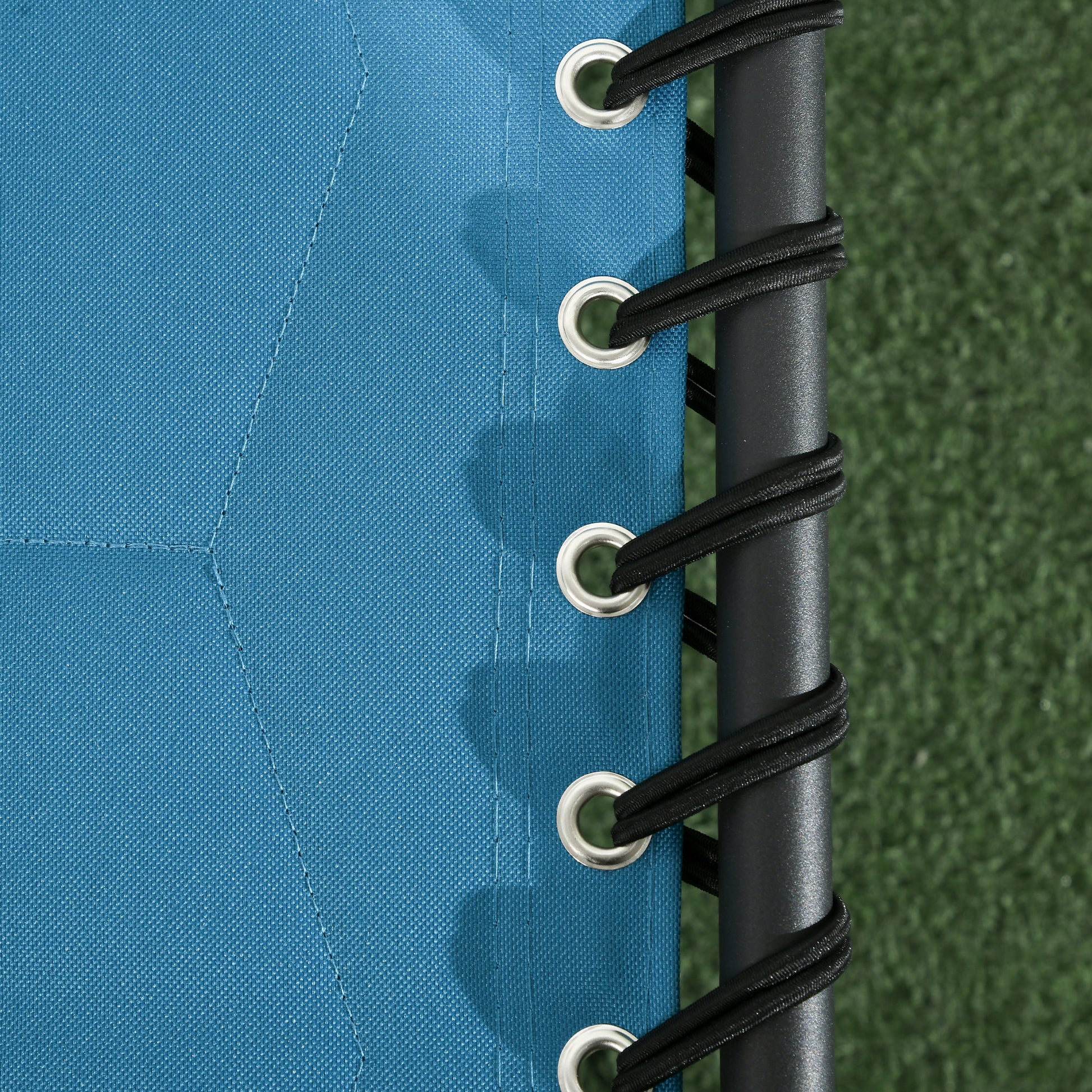 Blue canvas lounge chair fabric with reinforced grommets and black bungee cords