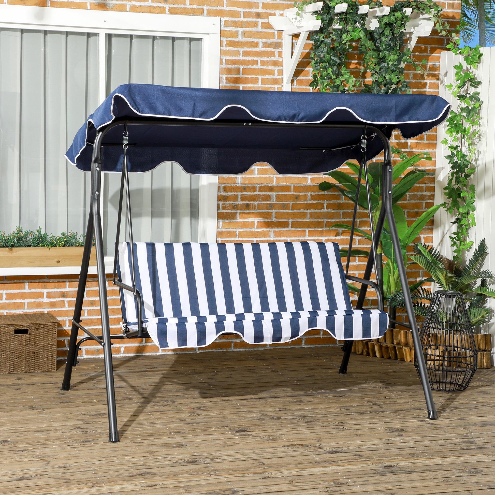 Navy blue and white striped patio swing with a dark metal frame and scalloped canopy