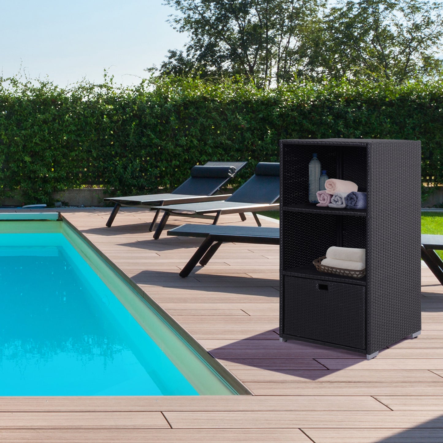 Black wicker outdoor cabinet with shelves and drawer holding towels and bottles