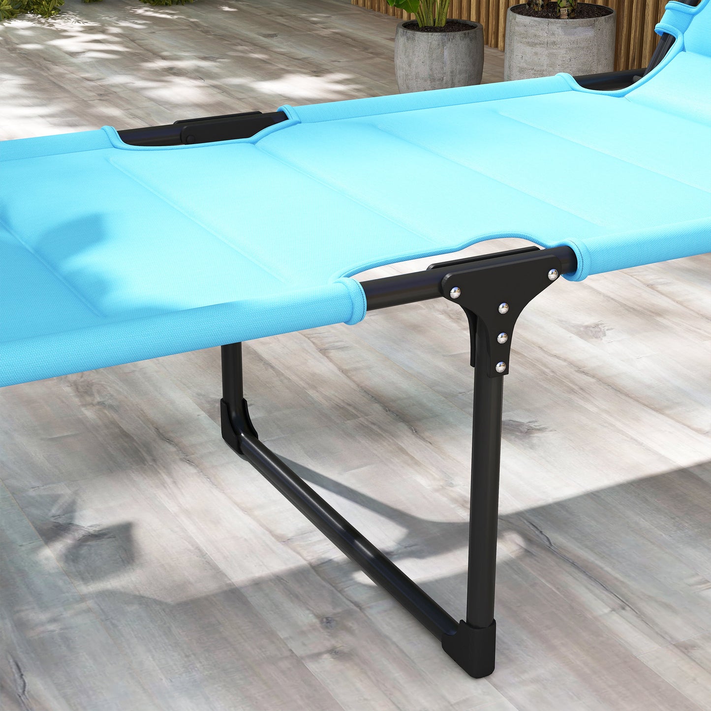 Sky blue canvas camping cot with black metal frame for outdoor relaxation