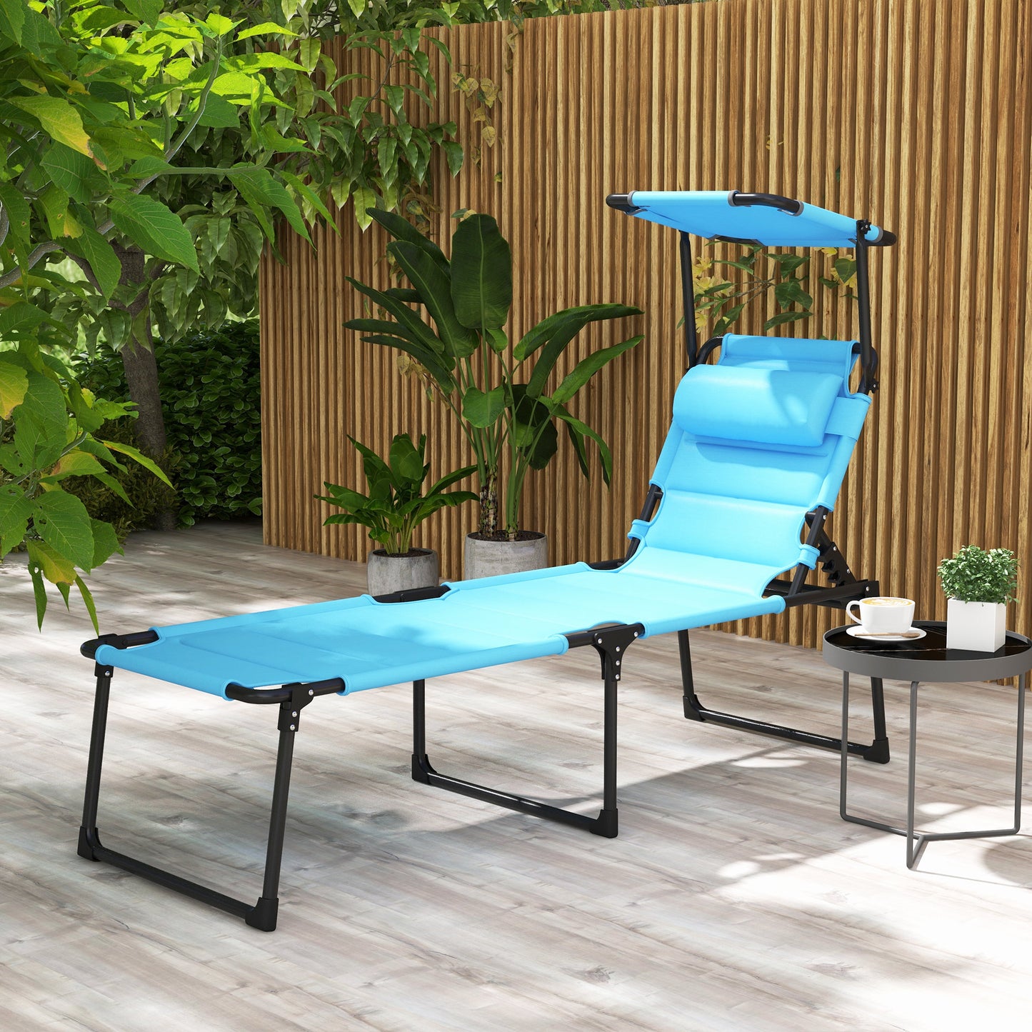 Blue adjustable lounge chair with canopy for outdoor relaxation