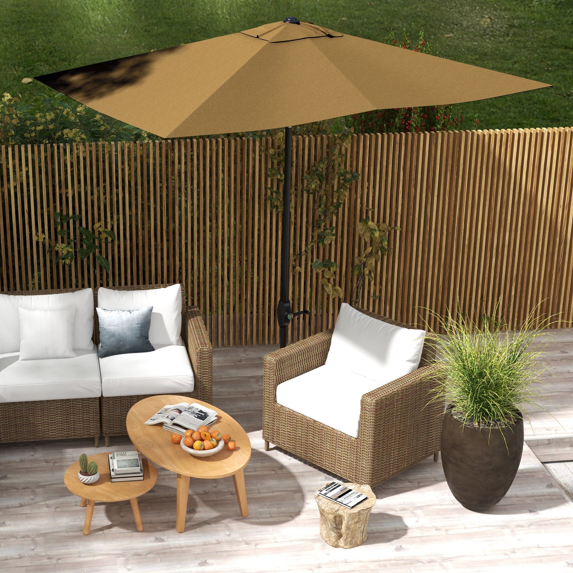 Rattan sectional sofa with white cushions and a blue accent pillow on a patio