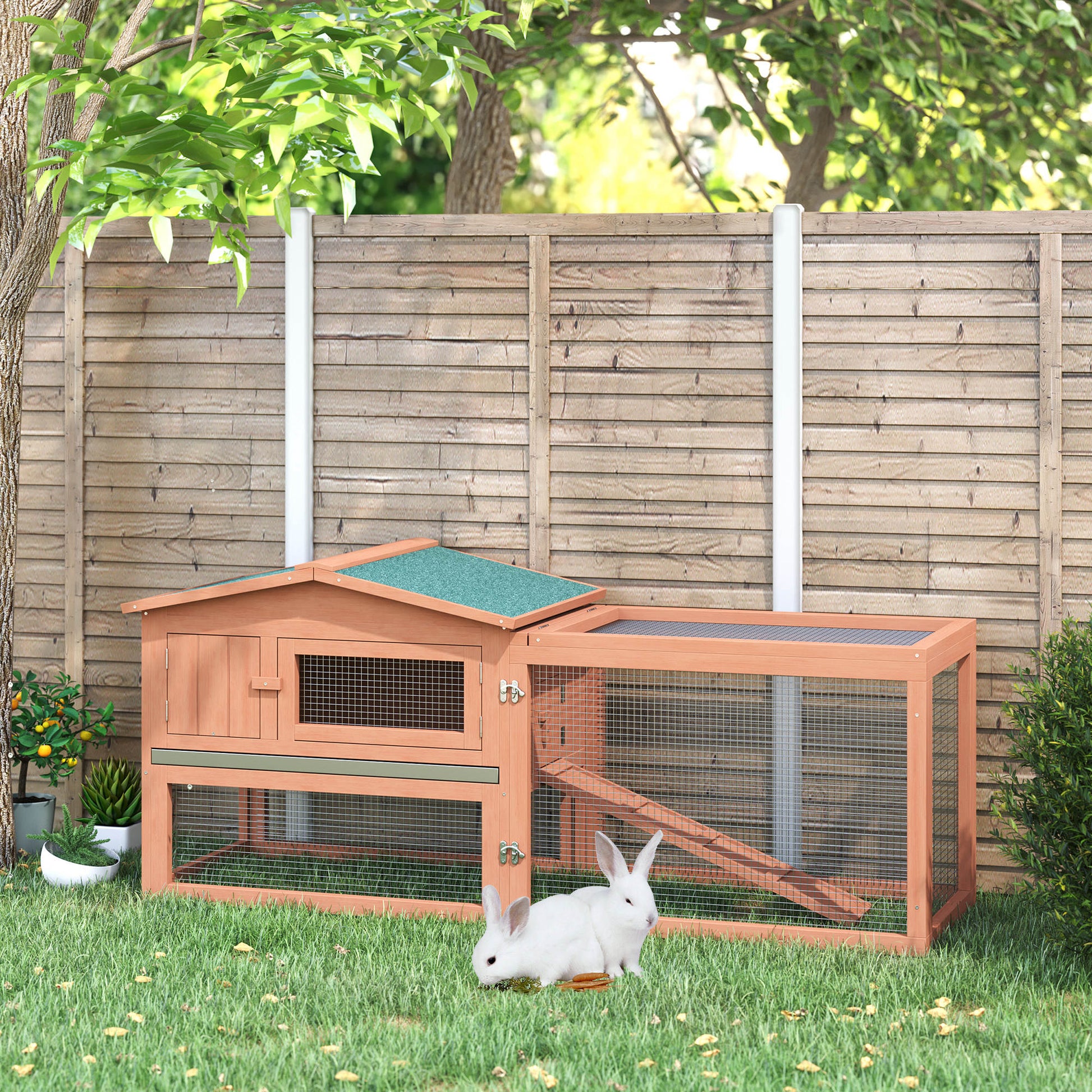 Wooden outdoor rabbit hutch with two compartments and green roof
