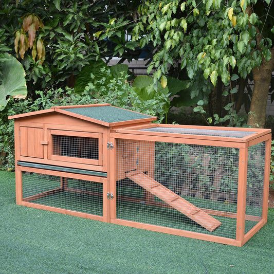 Wooden twotier rabbit hutch with green asphalt roof and ramp