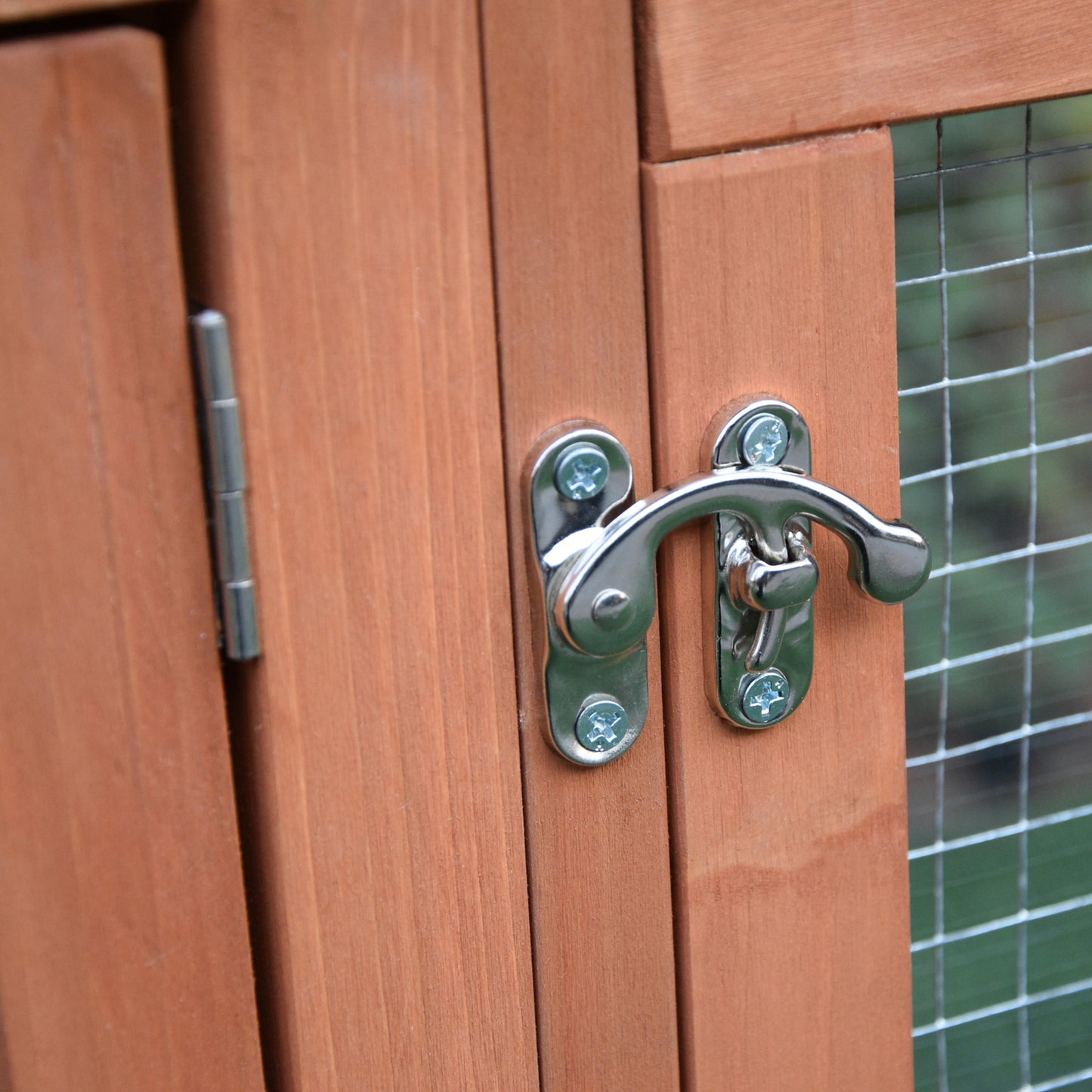 Wooden hutch with secure latch and silver hinge designed for small pets